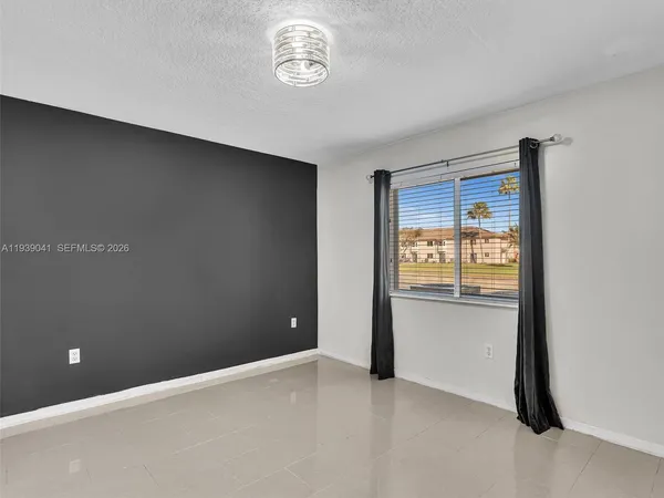 a bedroom with a bed and a table
