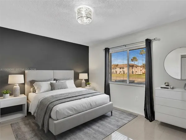 a view of a room with an entryway and chandelier