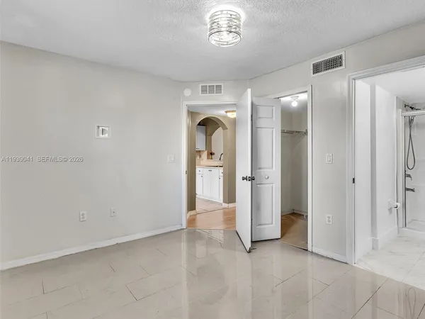 a bathroom with a shower and a toilet