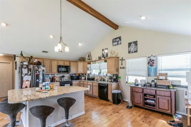 a bedroom with furniture and a chandelier