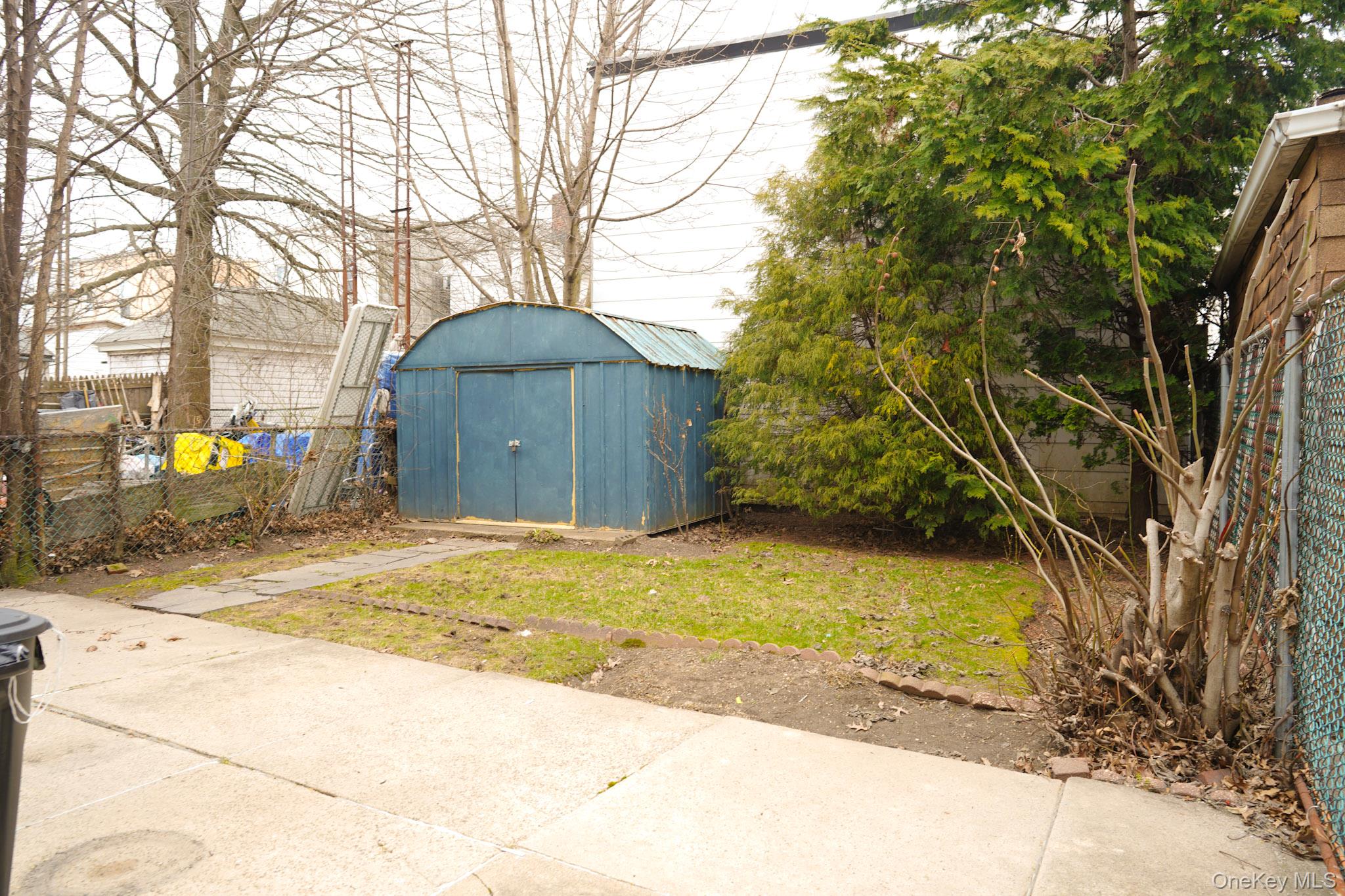 80-33 90th Road Queens, NY 11421 - Photo 18 of 20 a view of outdoor space and street view