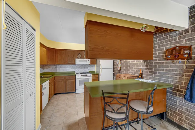 a kitchen with a table and chairs in it