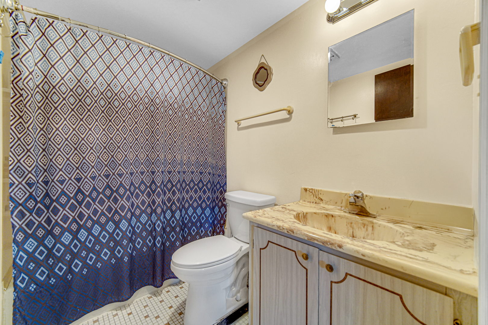 124 East Bailey Road, Unit E Naperville, IL 60565 - Photo 16 of 20 a bathroom with a granite countertop toilet sink and mirror