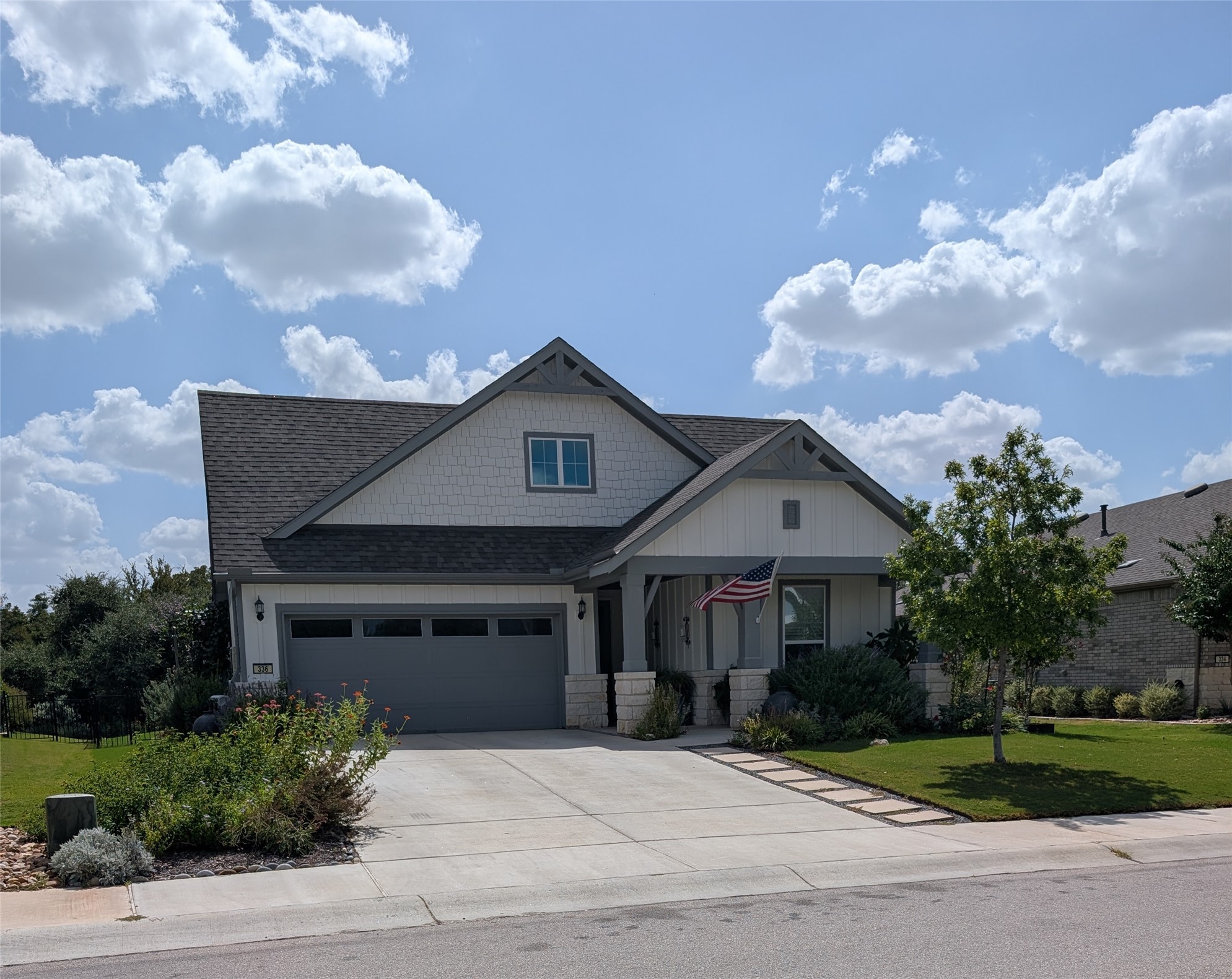 336 Kitty Hawk Road Georgetown, TX 78633 - Photo 1 of 40 A classic concrete driveway leads to this modern two-car garage under a gabled roofline.