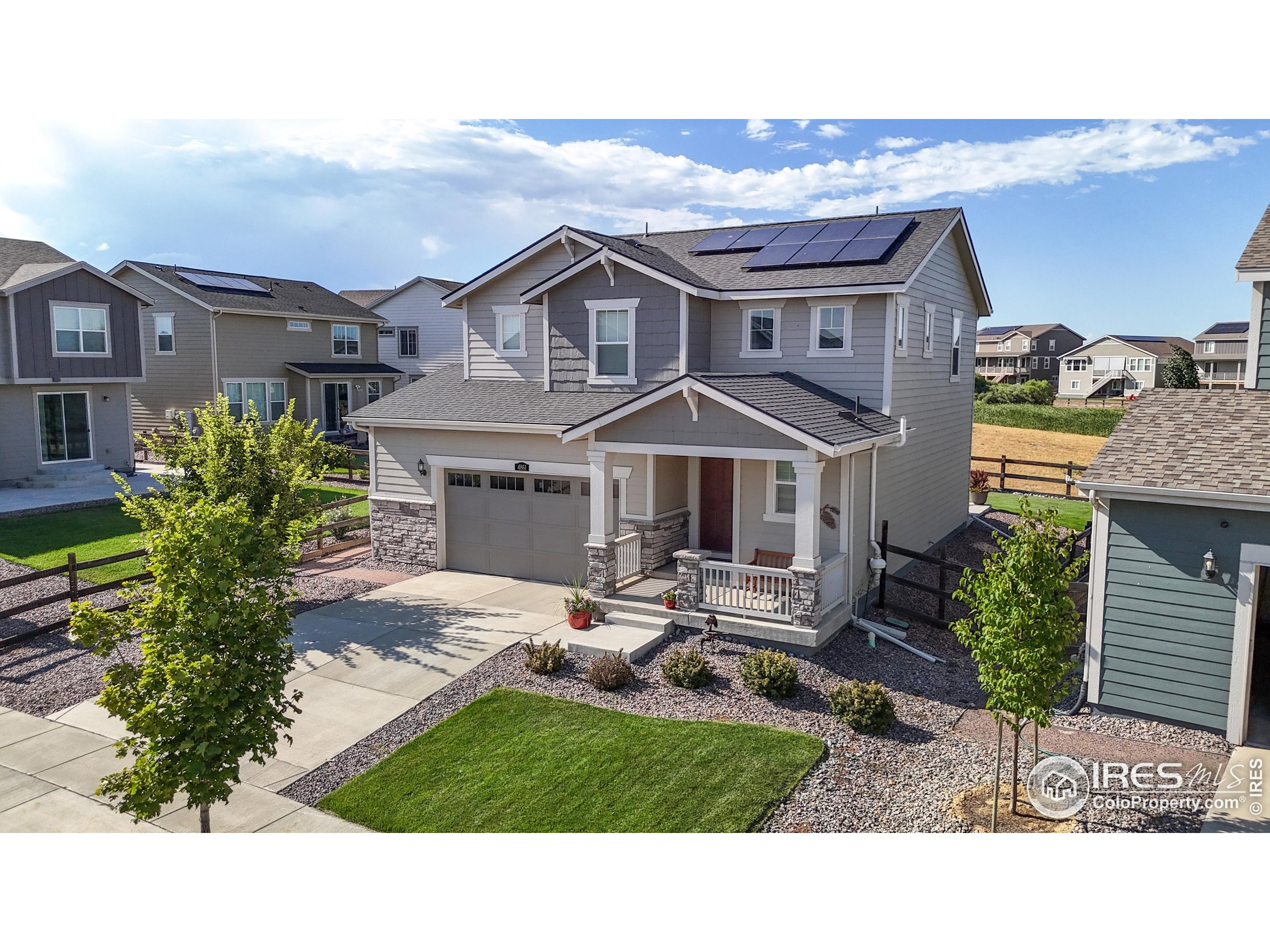 4861 St Vrain Road Firestone, CO 80504 - Photo 1 of 43 a aerial view of a house with yard porch and furniture