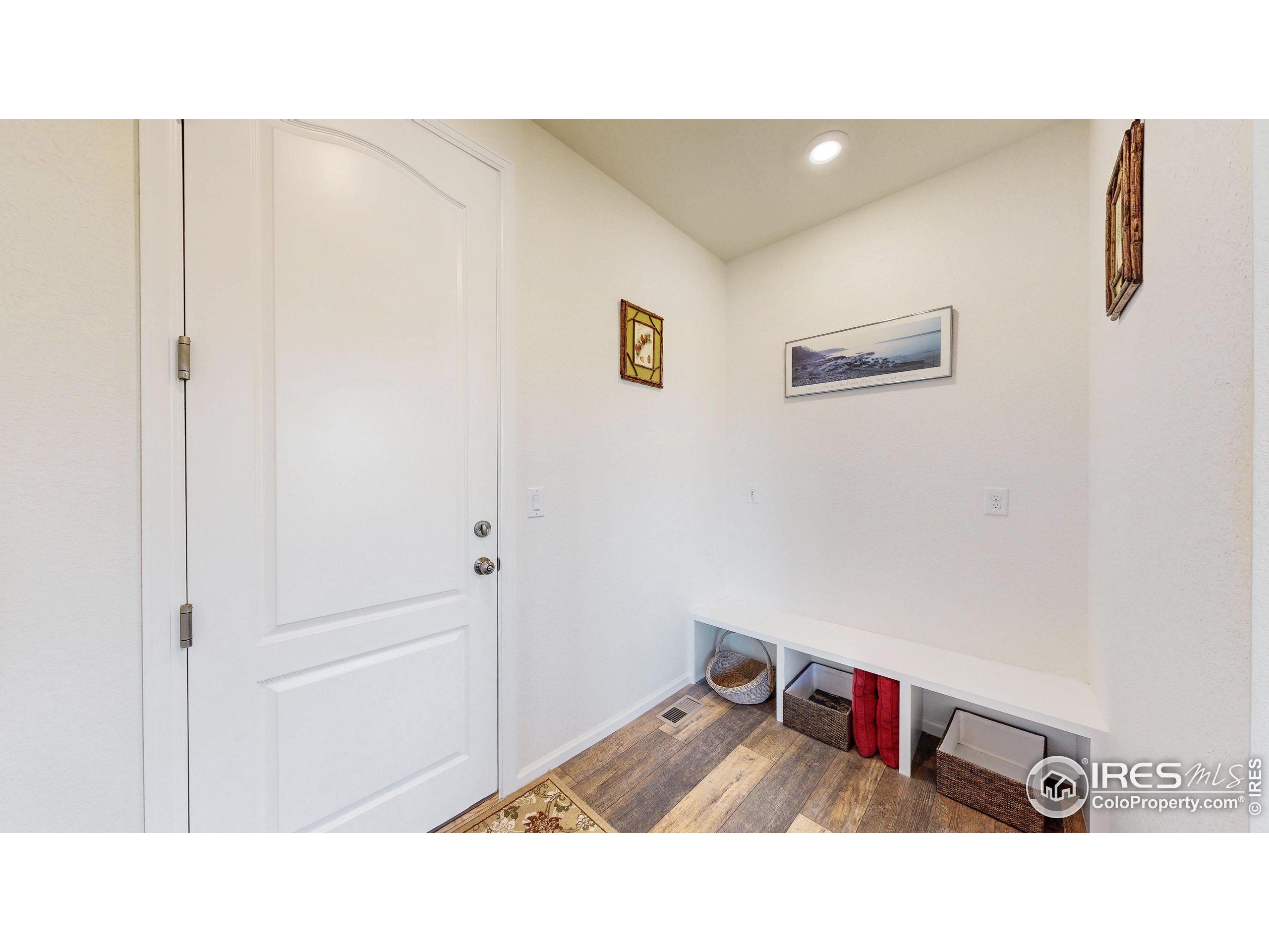 4861 St Vrain Road Firestone, CO 80504 - Photo 15 of 43 a room with a bed and mirror