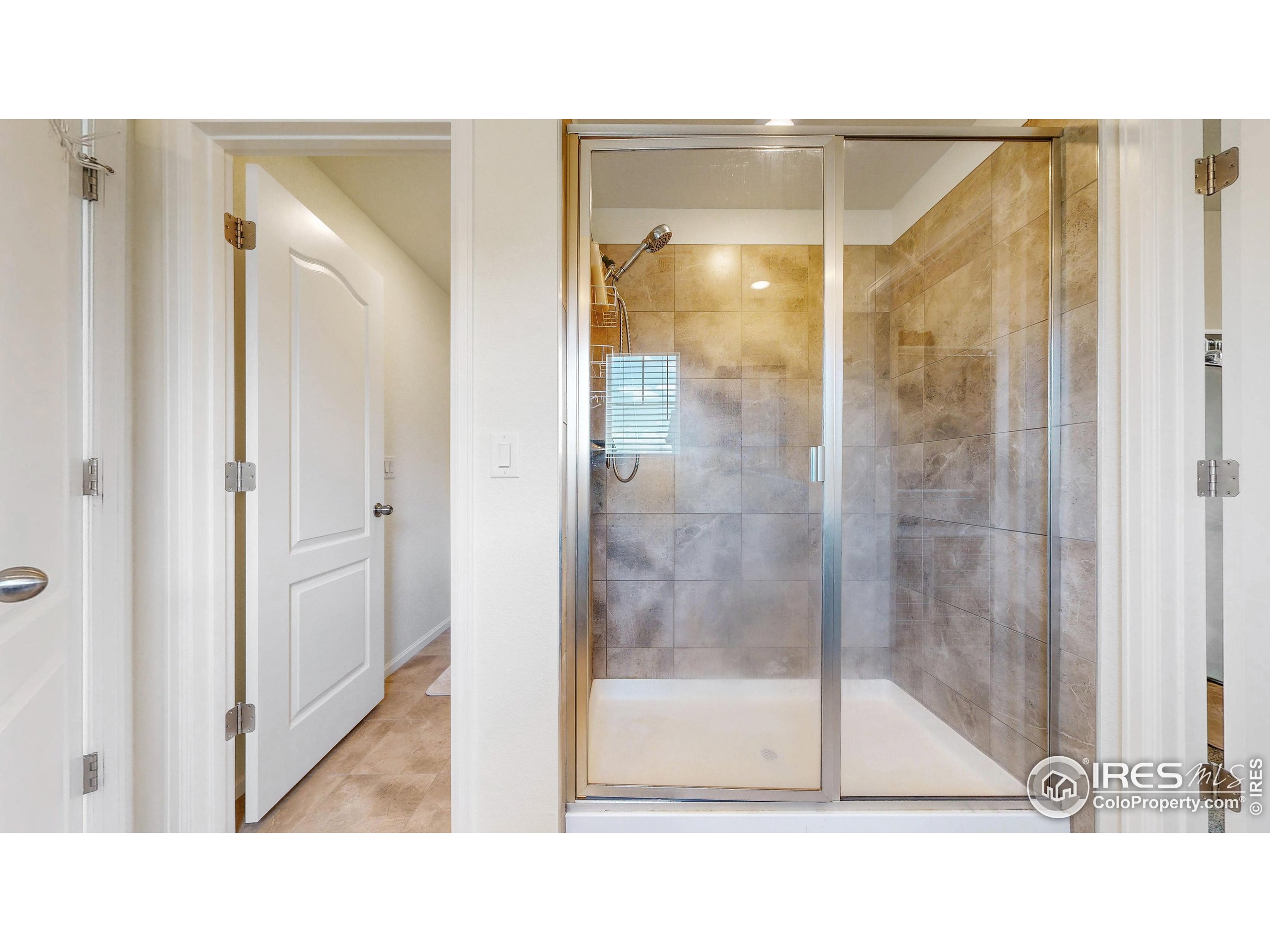 4861 St Vrain Road Firestone, CO 80504 - Photo 20 of 43 a bathroom with a shower