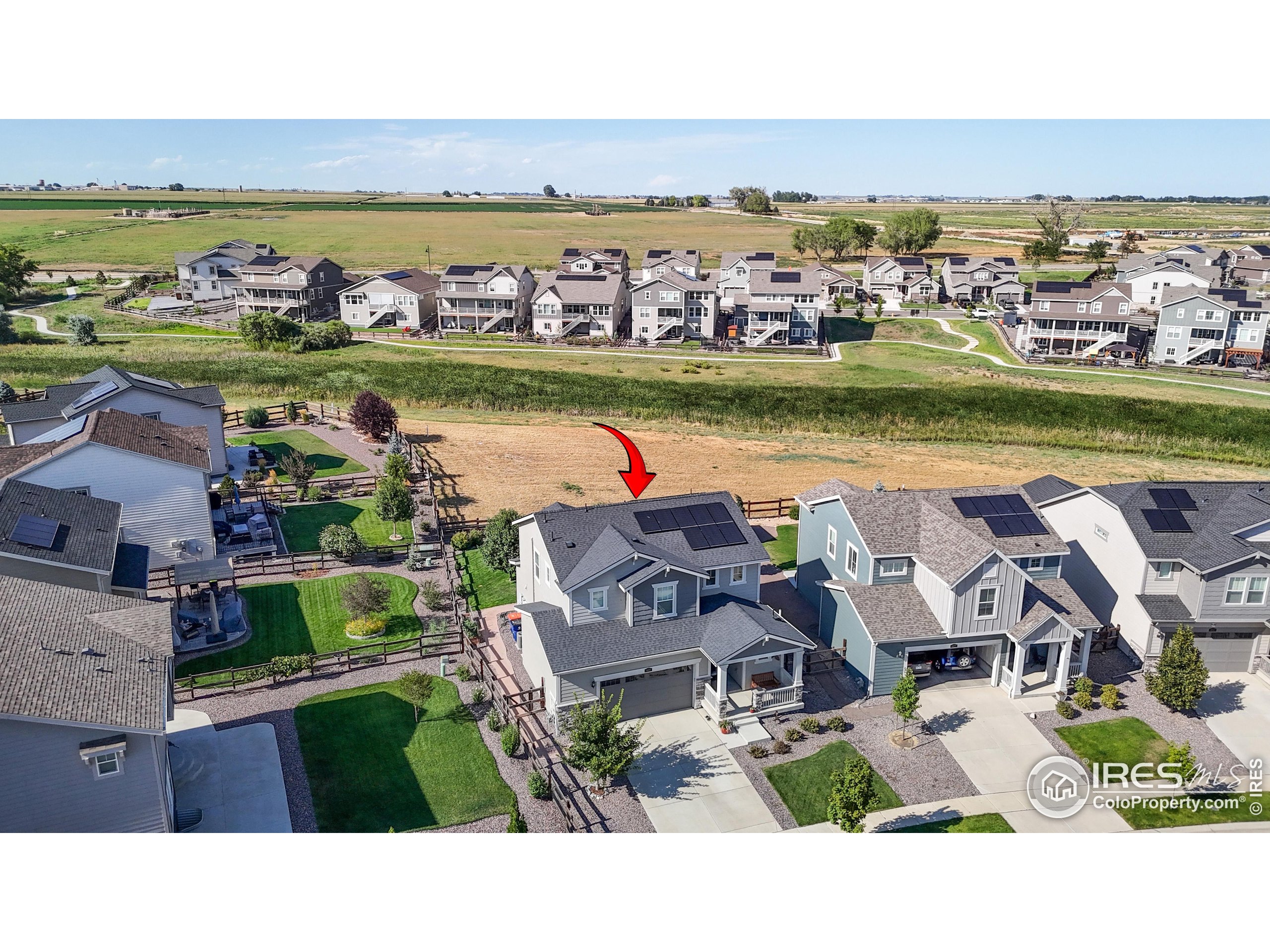 4861 St Vrain Road Firestone, CO 80504 - Photo 32 of 43 an aerial view of a house with a ocean view