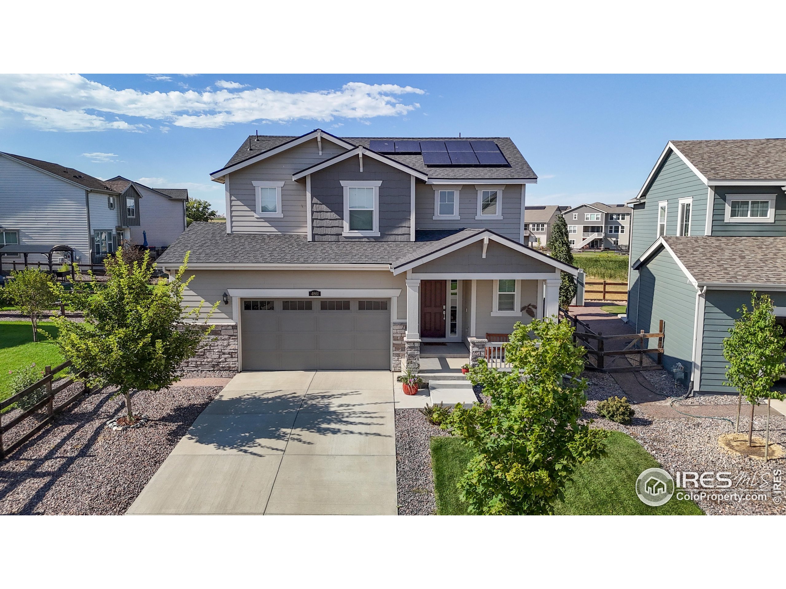 4861 St Vrain Road Firestone, CO 80504 - Photo 40 of 43 a house view with a garden space