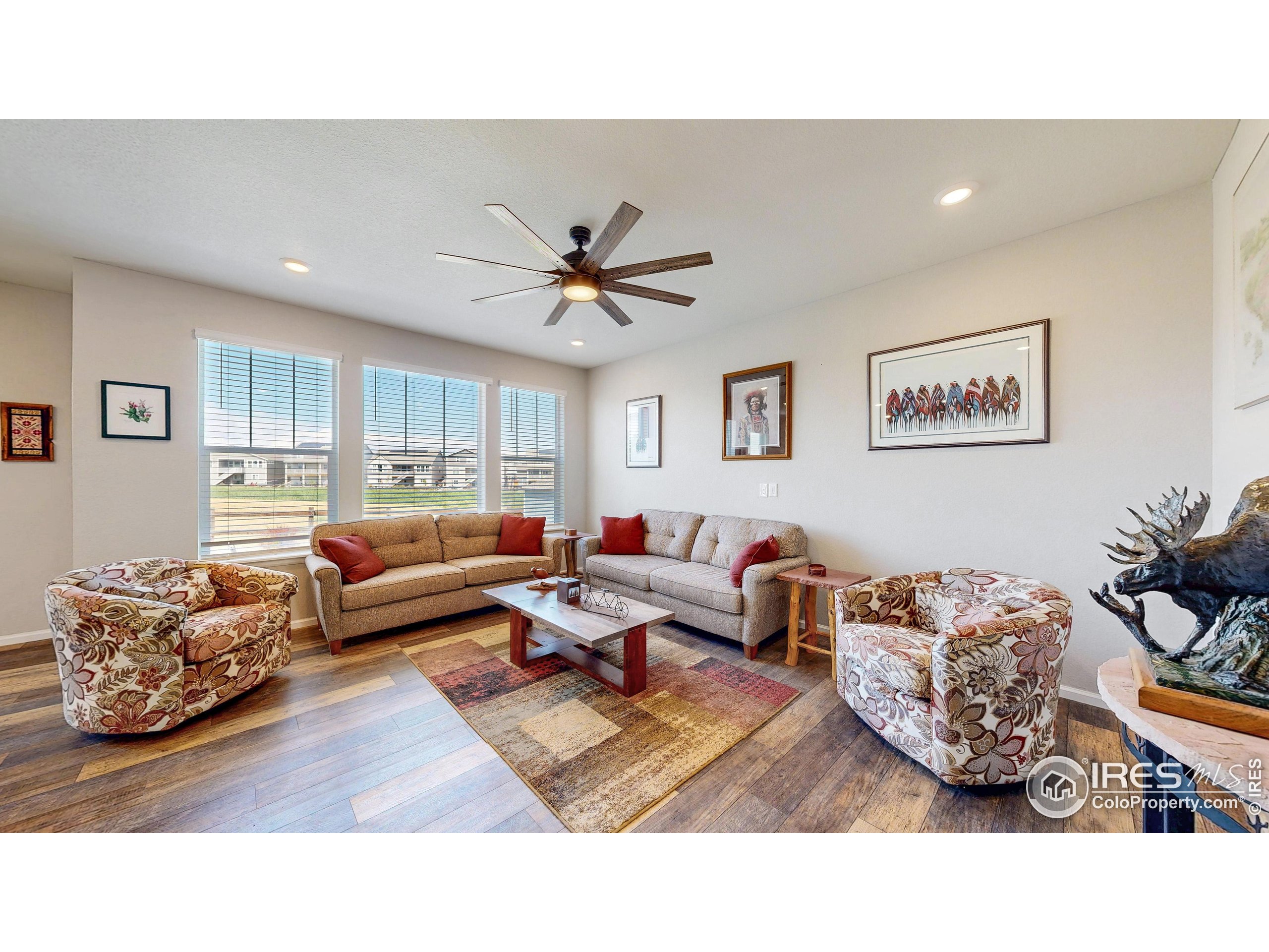 4861 St Vrain Road Firestone, CO 80504 - Photo 5 of 43 a living room with furniture rug and window