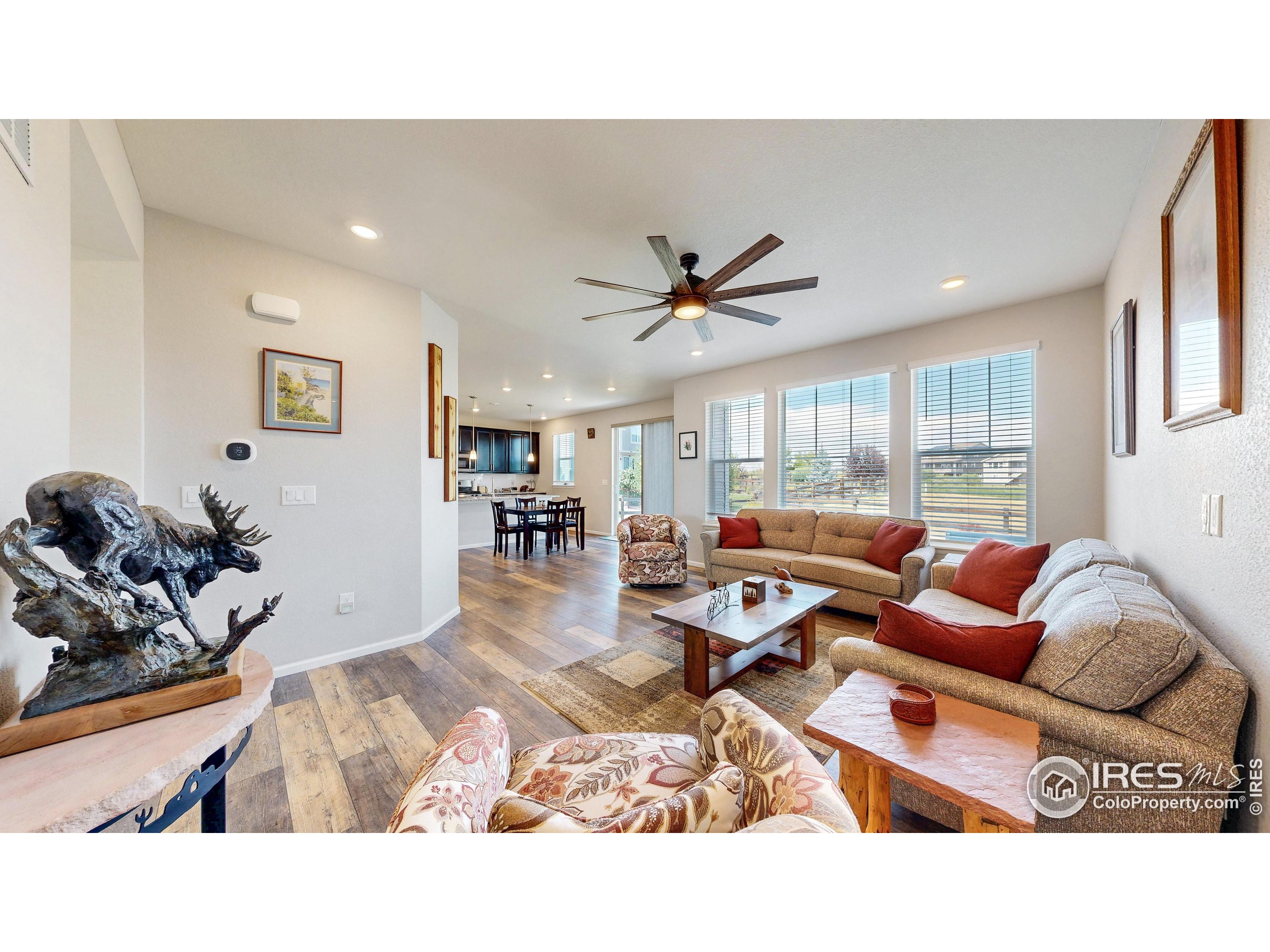 4861 St Vrain Road Firestone, CO 80504 - Photo 6 of 43 a living room with furniture and a large window