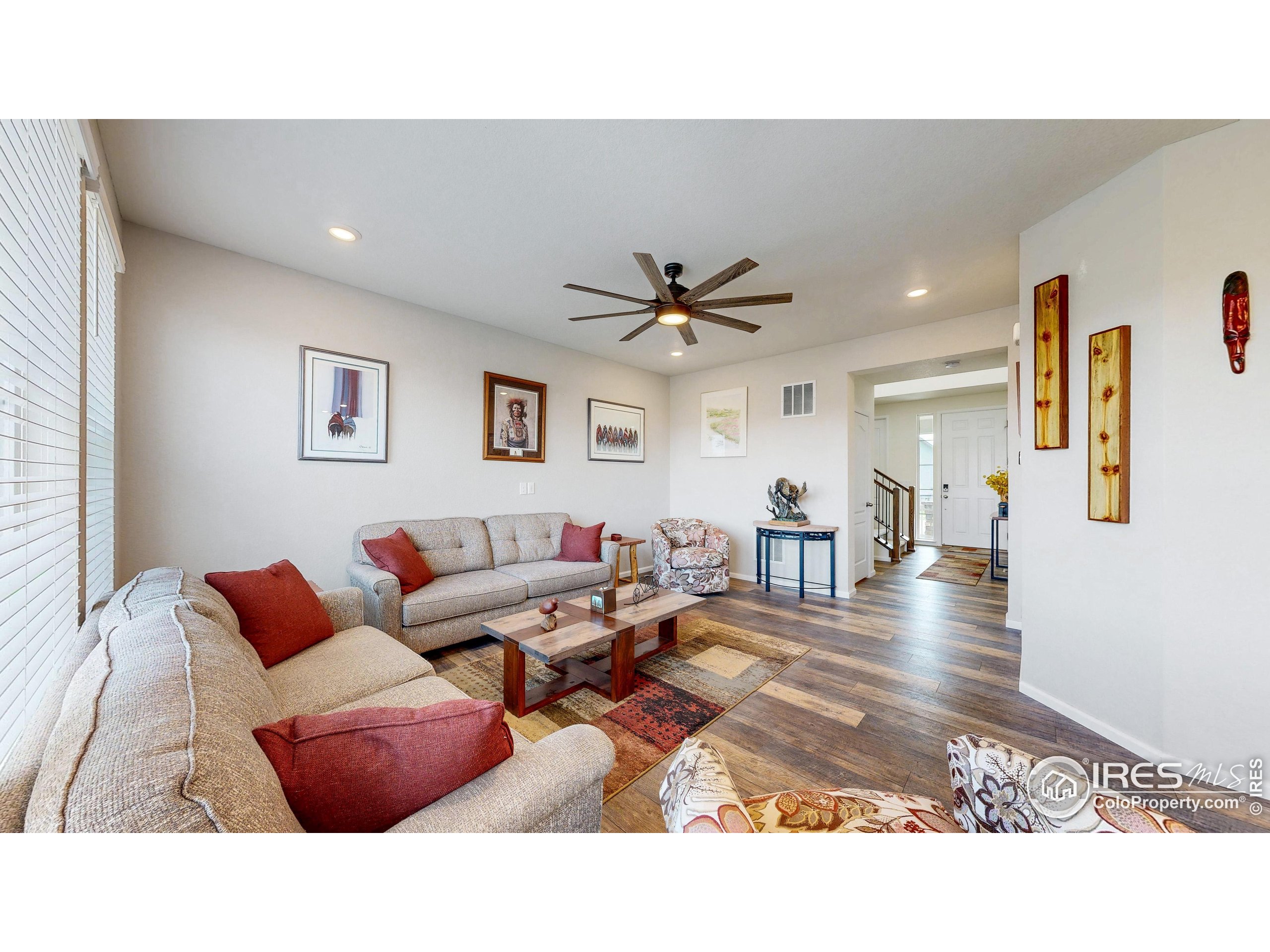 4861 St Vrain Road Firestone, CO 80504 - Photo 7 of 43 a living room with furniture and wooden floor
