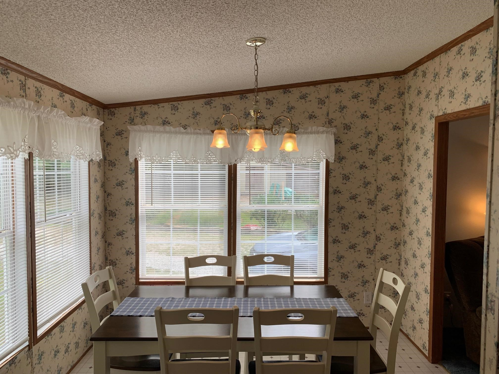 3950 Bowmantown Road Roxboro, NC 27574 - Photo 16 of 28 a room with furniture and a flat screen tv