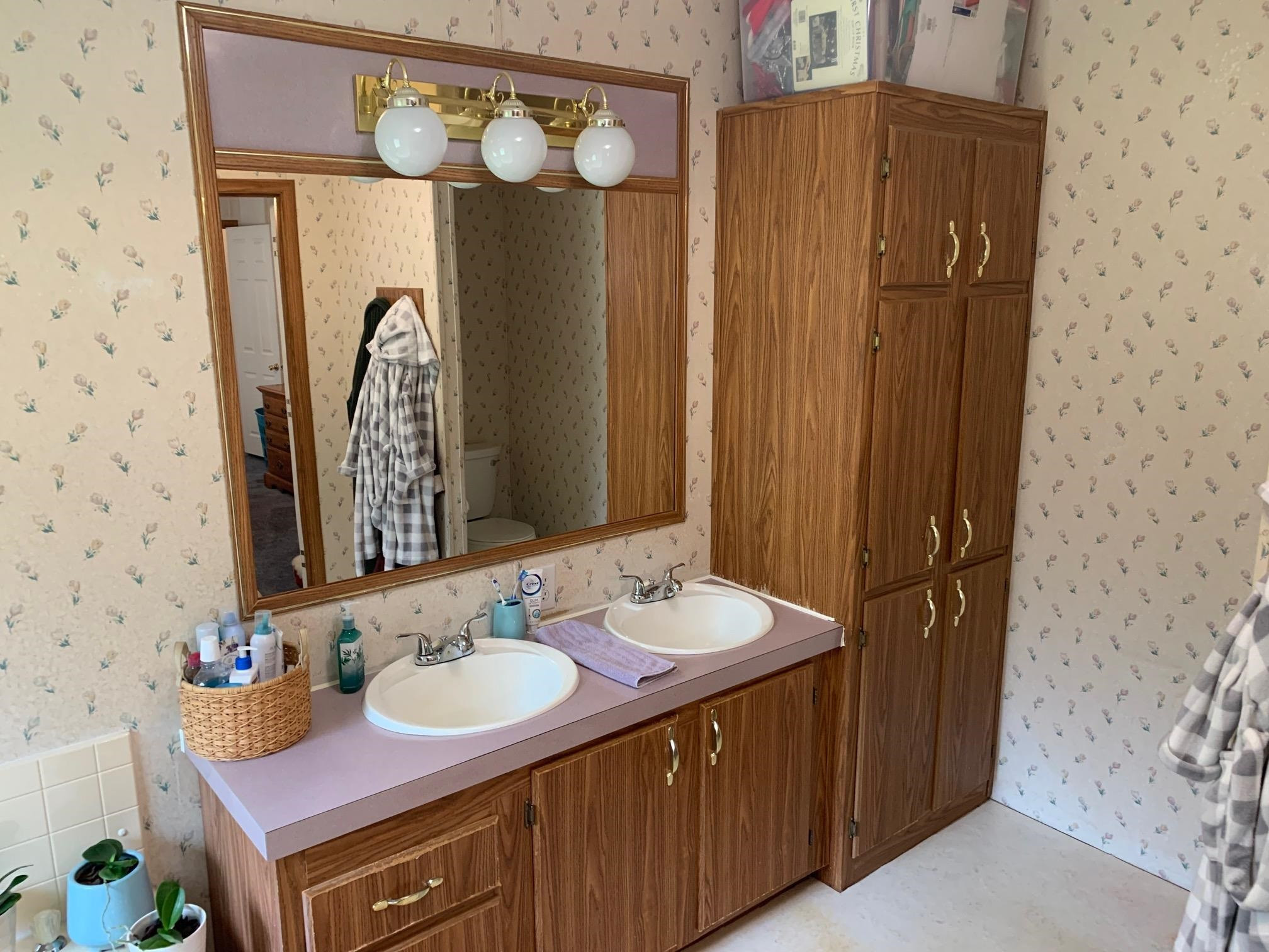 3950 Bowmantown Road Roxboro, NC 27574 - Photo 21 of 28 a bathroom with a sink and a mirror