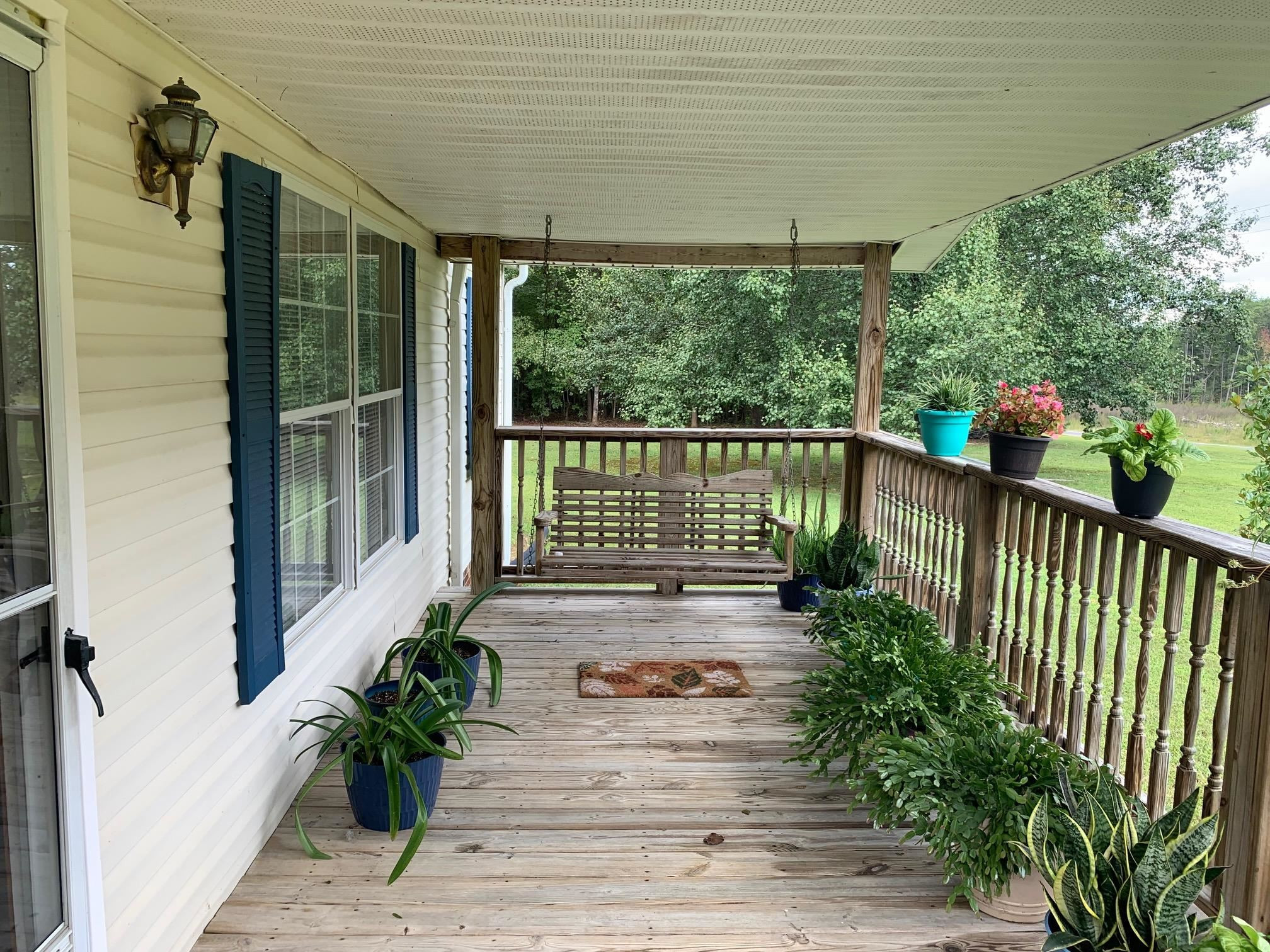 3950 Bowmantown Road Roxboro, NC 27574 - Photo 5 of 28 a view of a balcony with chairs