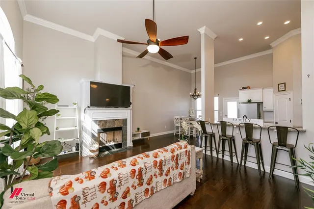 a living room with furniture fireplace and flat screen tv