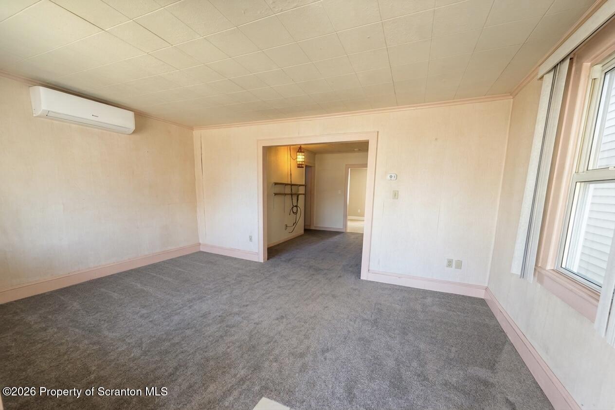 313 Dolph Street Jessup, PA 18434 - Photo 12 of 29 an empty room with windows and cabinet