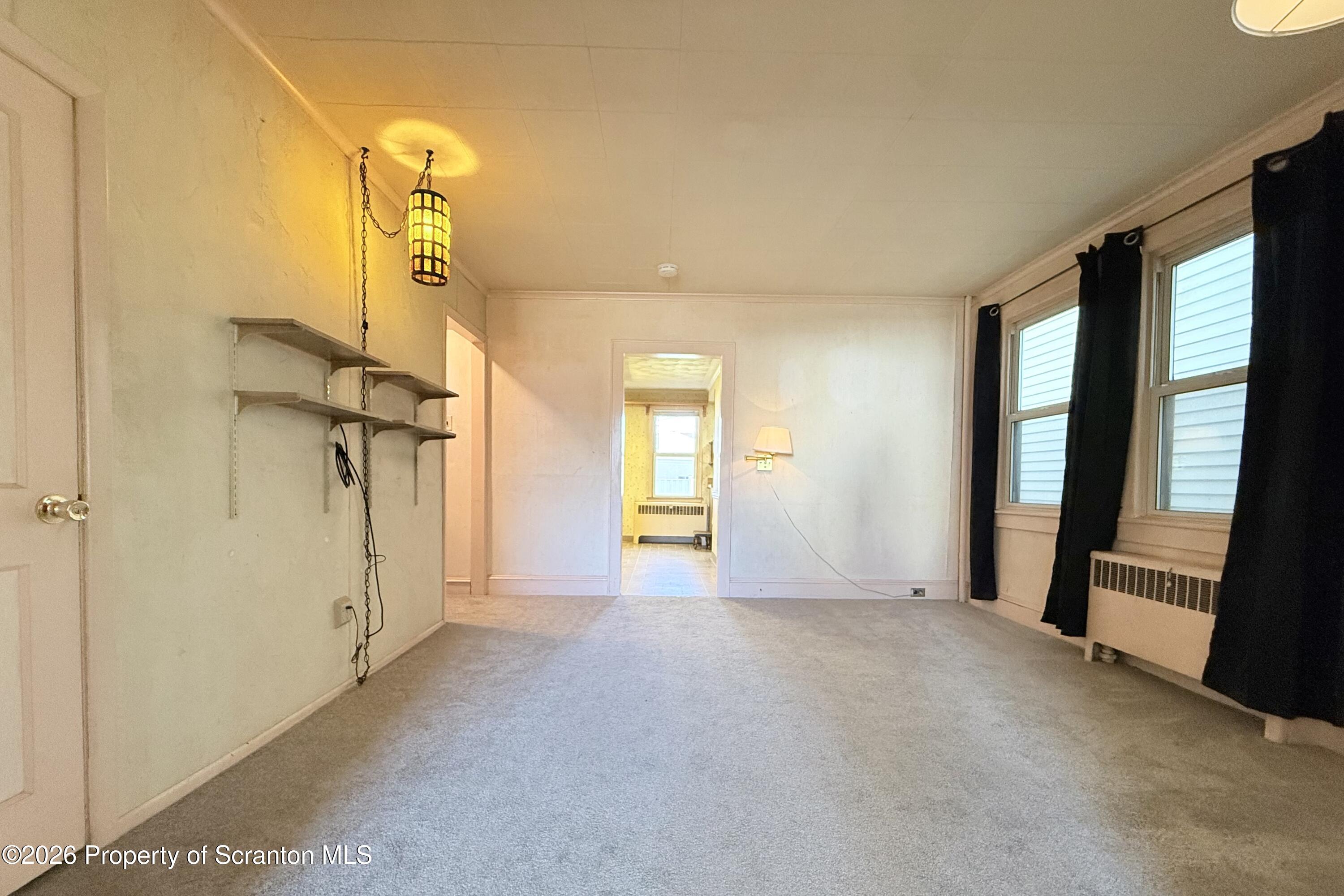 313 Dolph Street Jessup, PA 18434 - Photo 16 of 29 a view of empty room with a fireplace