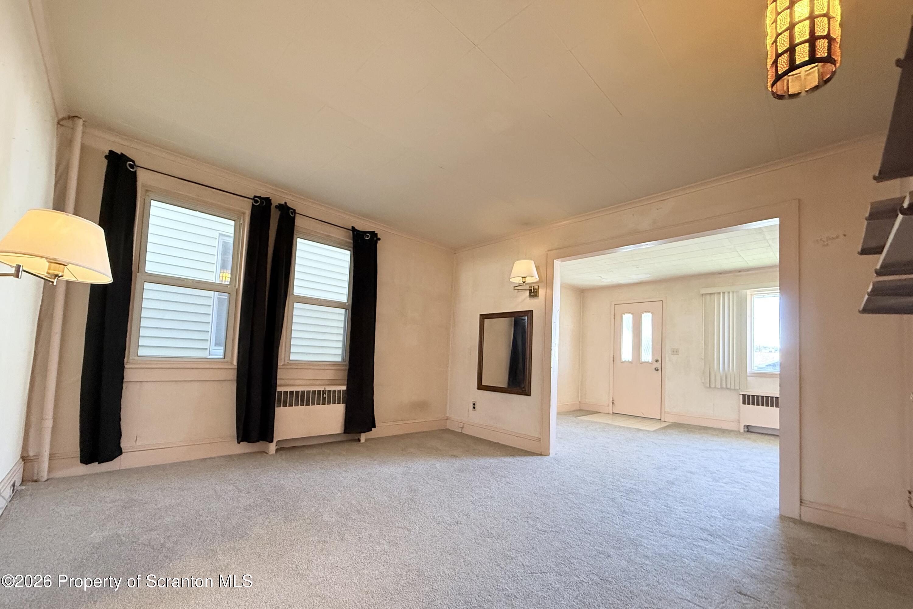 313 Dolph Street Jessup, PA 18434 - Photo 18 of 29 an empty room with windows and closet