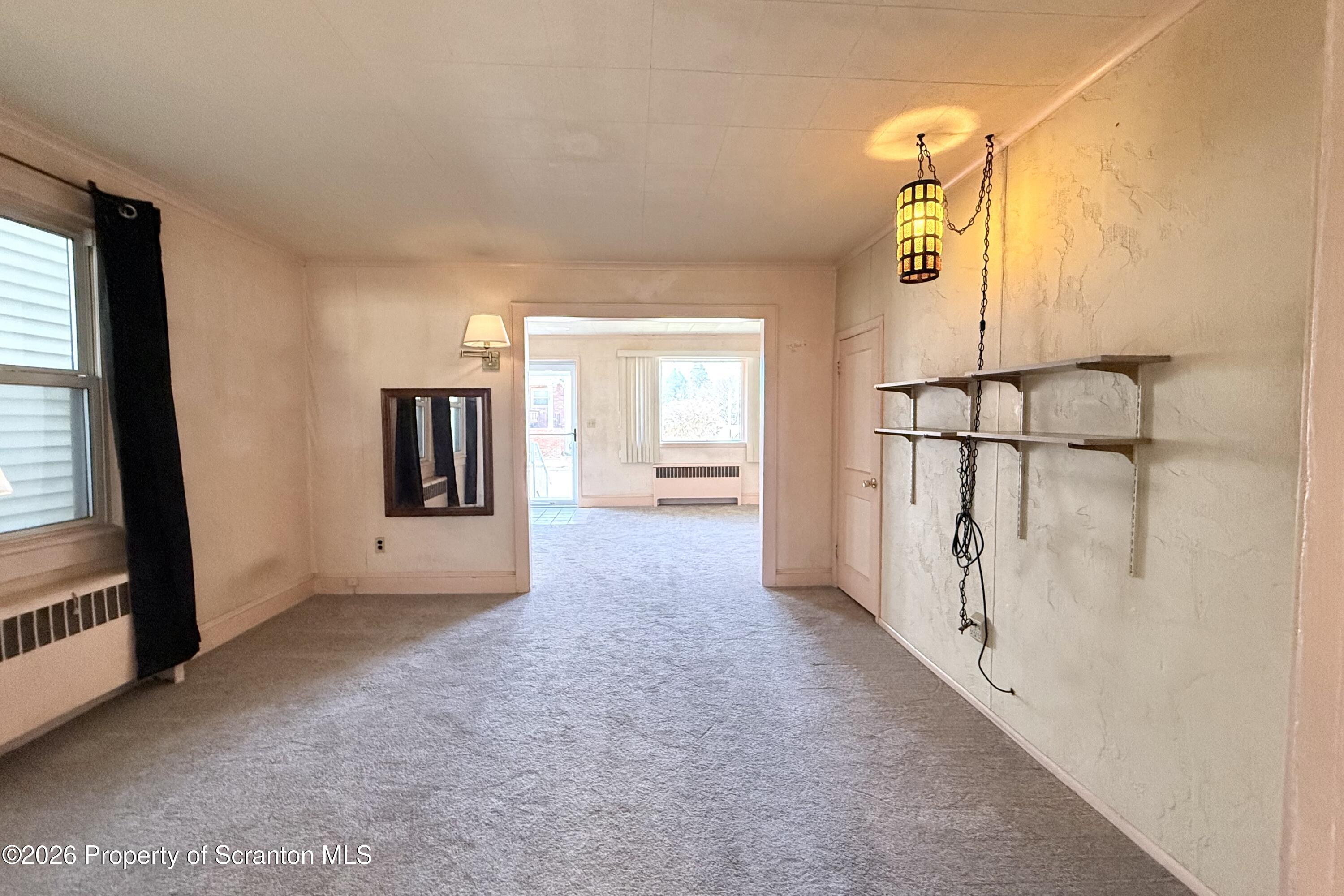 313 Dolph Street Jessup, PA 18434 - Photo 19 of 29 a view of a hallway with a window and a livingroom