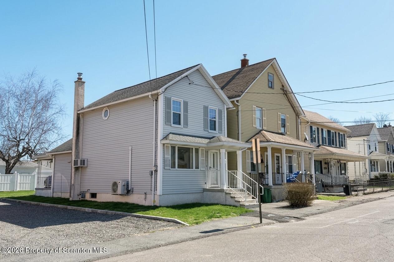 313 Dolph Street Jessup, PA 18434 - Photo 2 of 29 a front view of a house with a garden