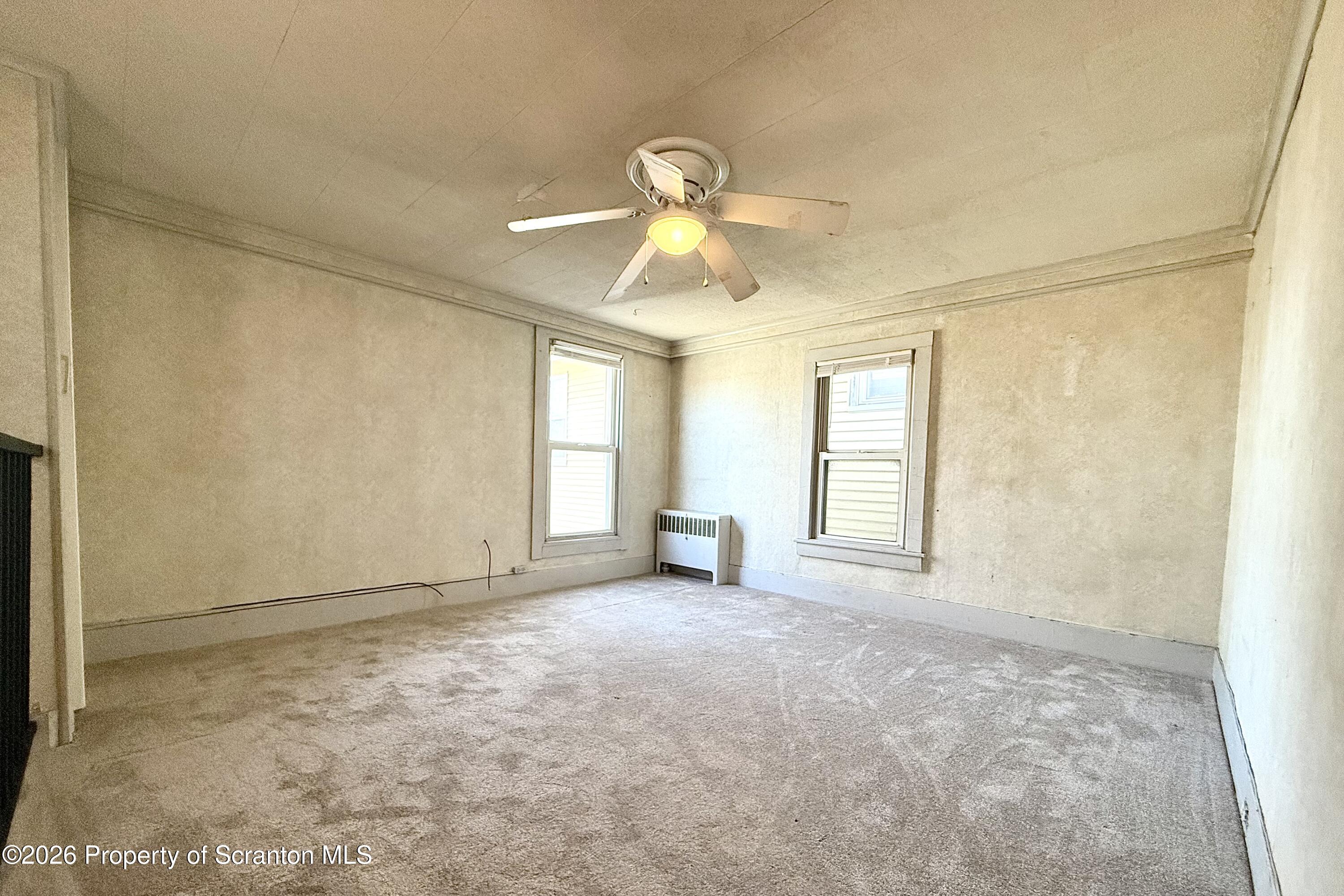 313 Dolph Street Jessup, PA 18434 - Photo 22 of 29 a view of an empty room with a window