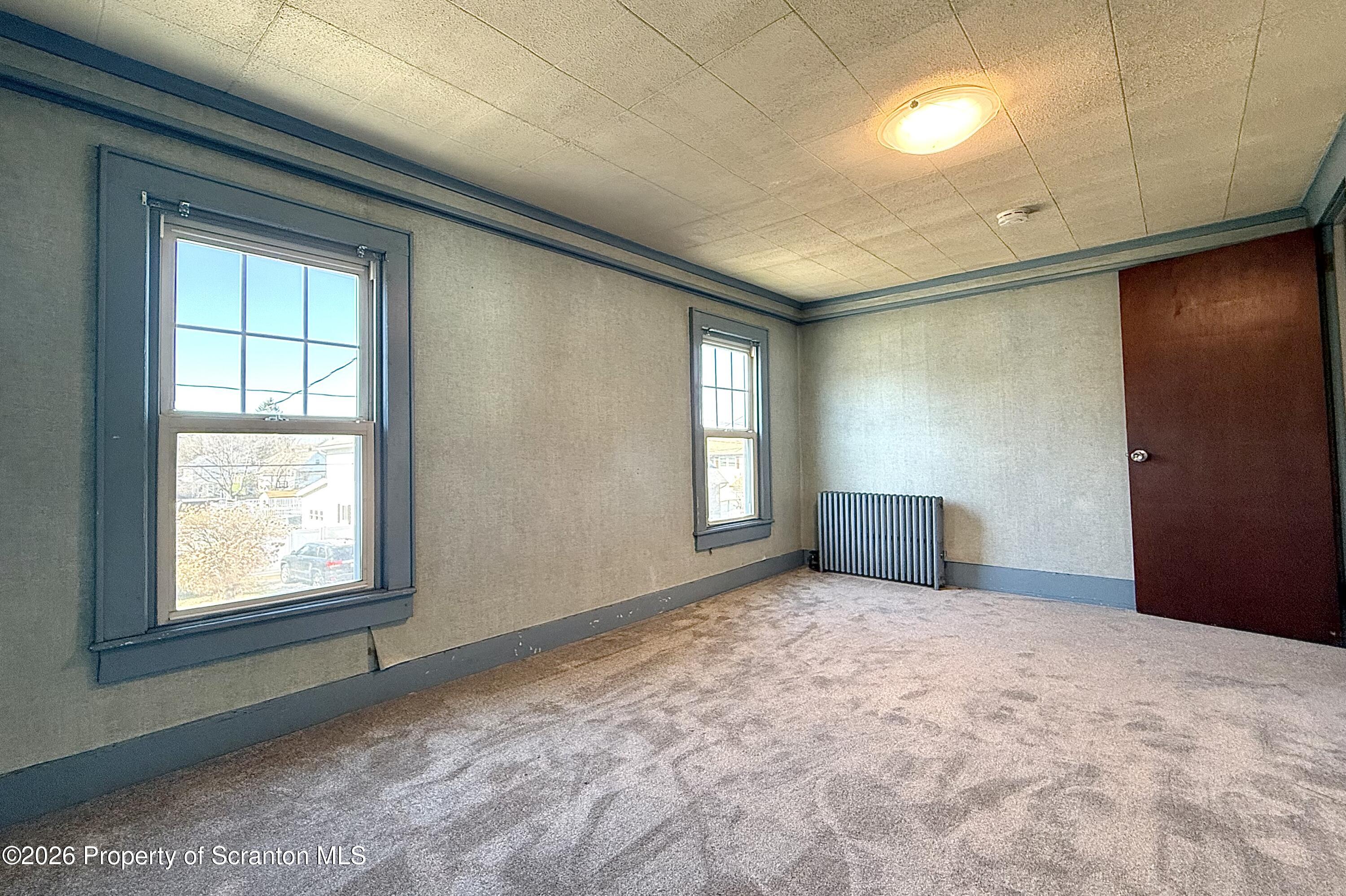 313 Dolph Street Jessup, PA 18434 - Photo 27 of 29 an empty room with windows