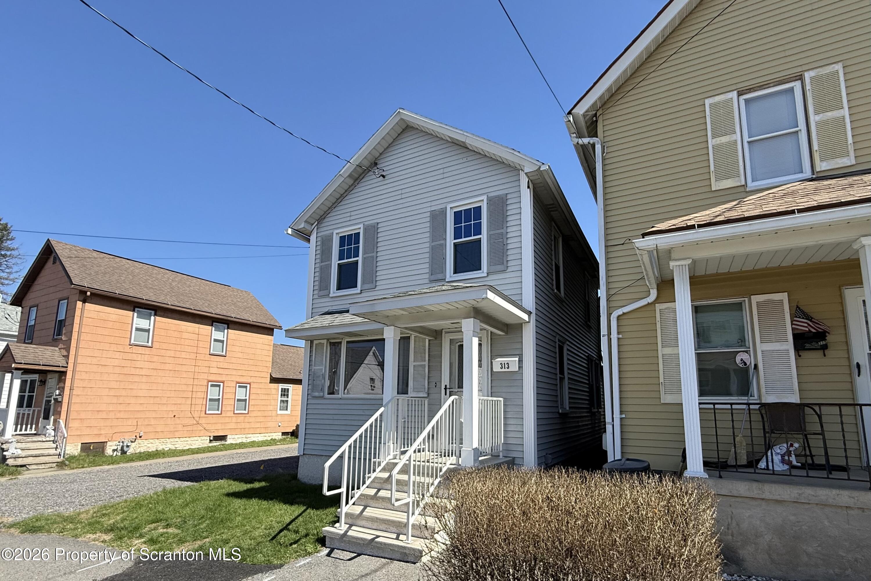 313 Dolph Street Jessup, PA 18434 - Photo 29 of 29 a front view of a house with a yard