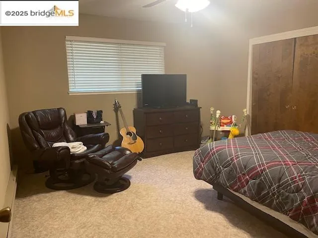 a bedroom with a bed and a table