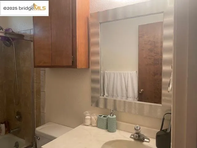 a bed sitting in a bedroom next to a small yard