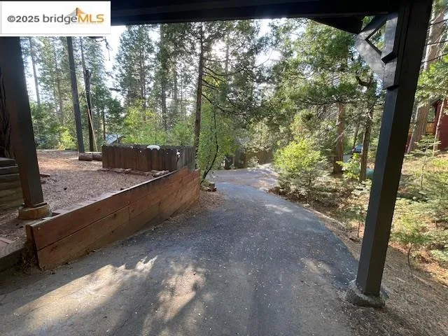 a view of a lake in between two of trees