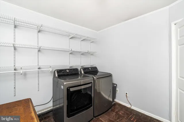 a utility room with washer and dryer