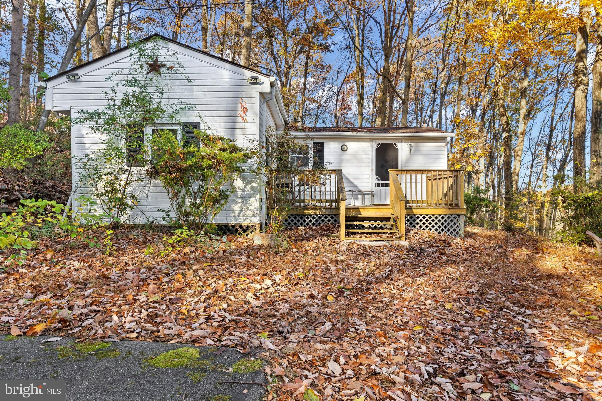 64 Hemlock Hill Road Airville, PA 17302 - Photo 1 of 11 a view of a bench in a backyard of the house