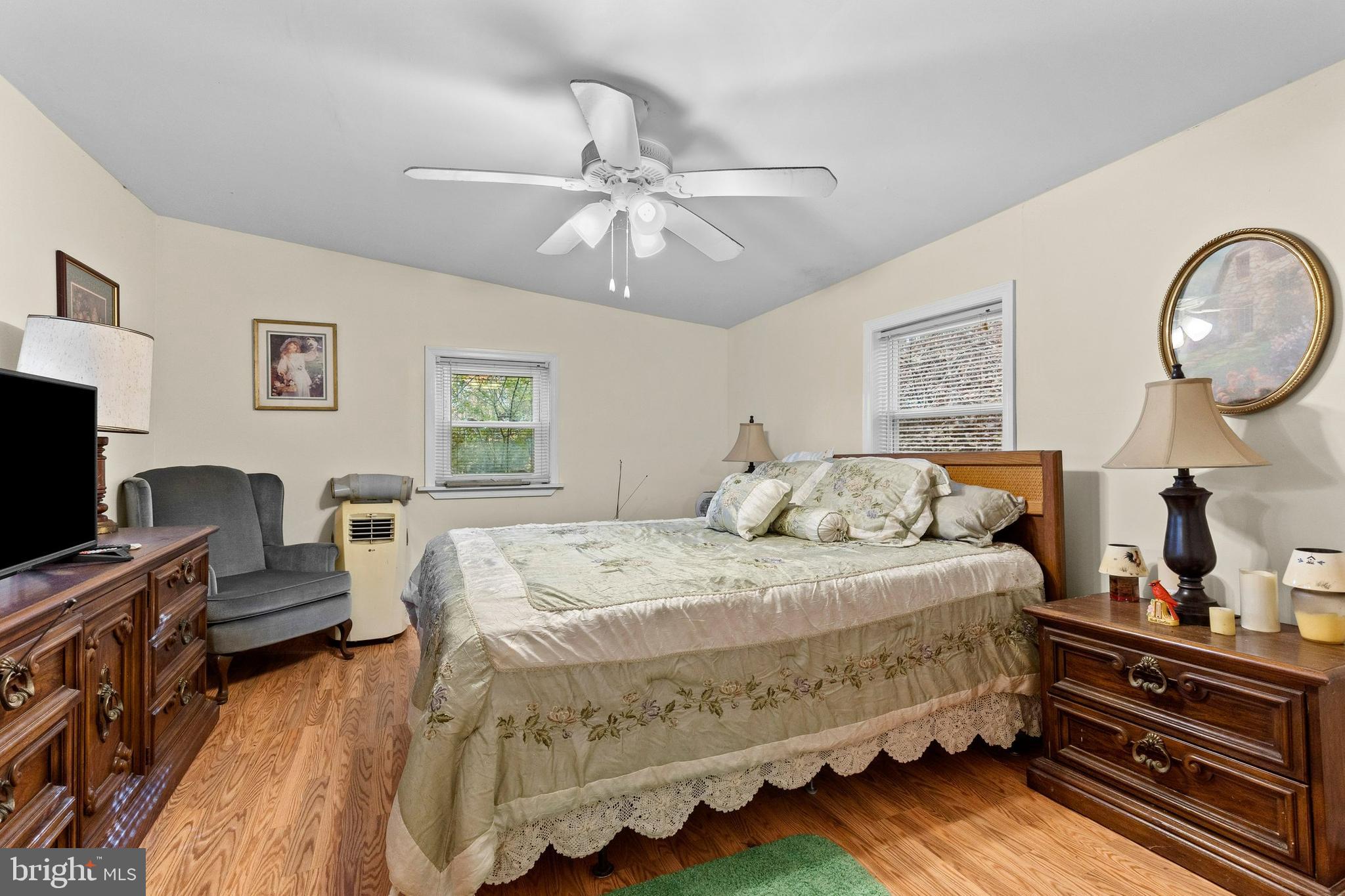 64 Hemlock Hill Road Airville, PA 17302 - Photo 7 of 11 a bedroom with a bed and dresser with mirror