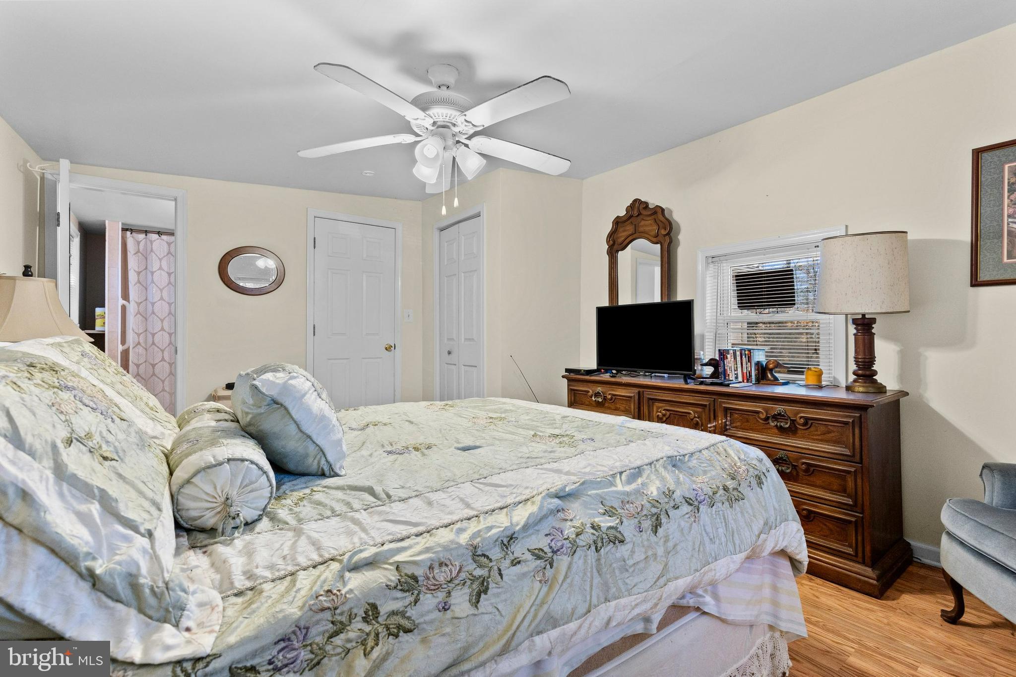 64 Hemlock Hill Road Airville, PA 17302 - Photo 8 of 11 a bedroom with a bed and a flat screen tv