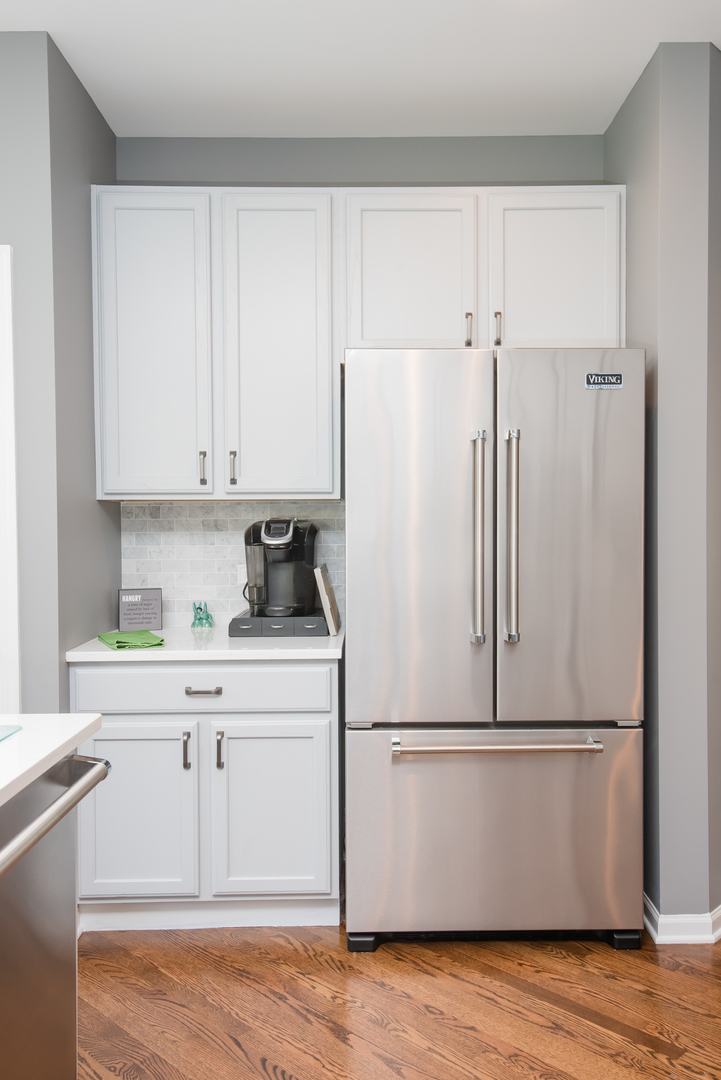 524 Bridgestone Court Inverness, IL 60010 - Photo 17 of 44 a white refrigerator freezer sitting in a kitchen
