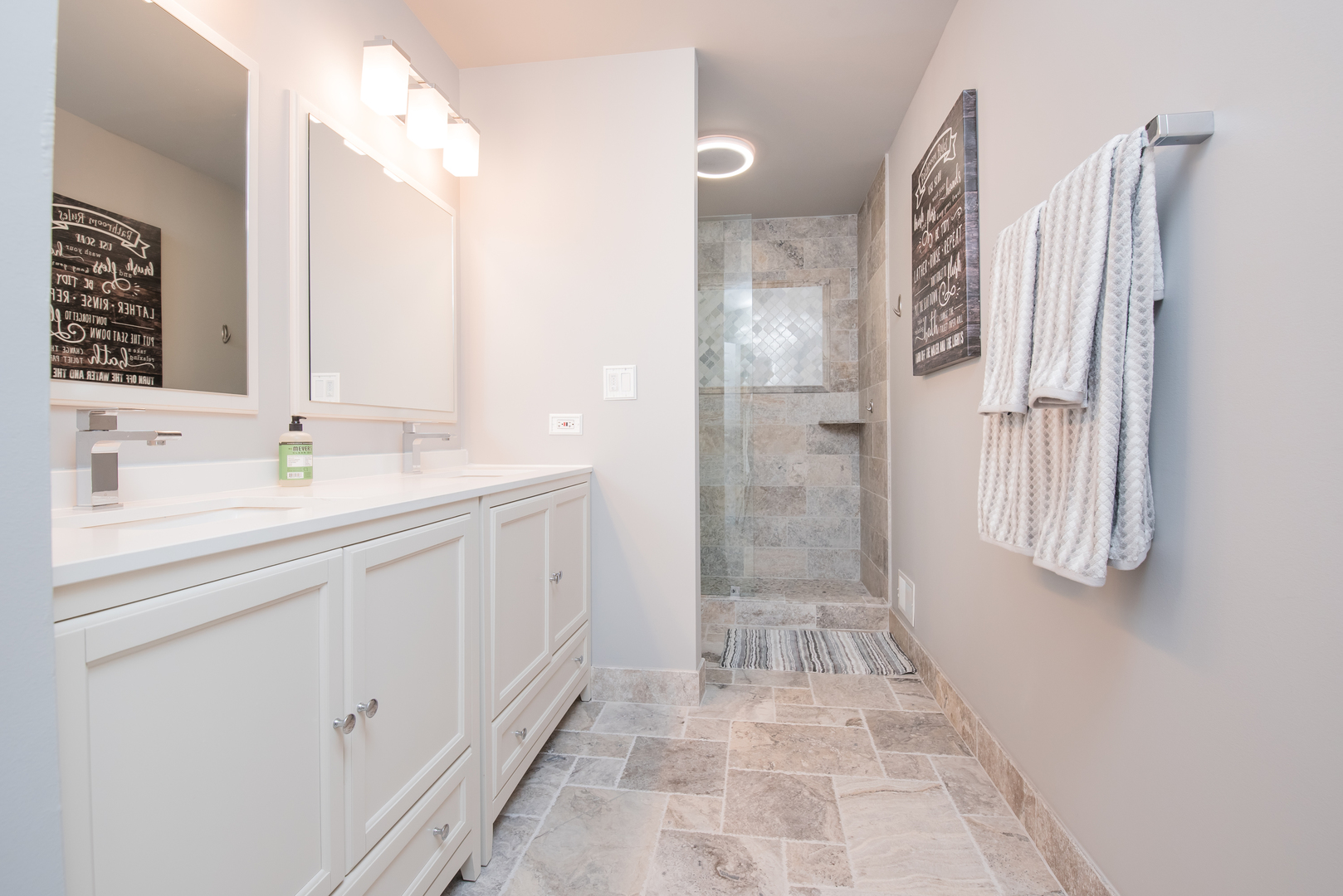 524 Bridgestone Court Inverness, IL 60010 - Photo 27 of 44 a spacious bathroom with a shower sink and mirror