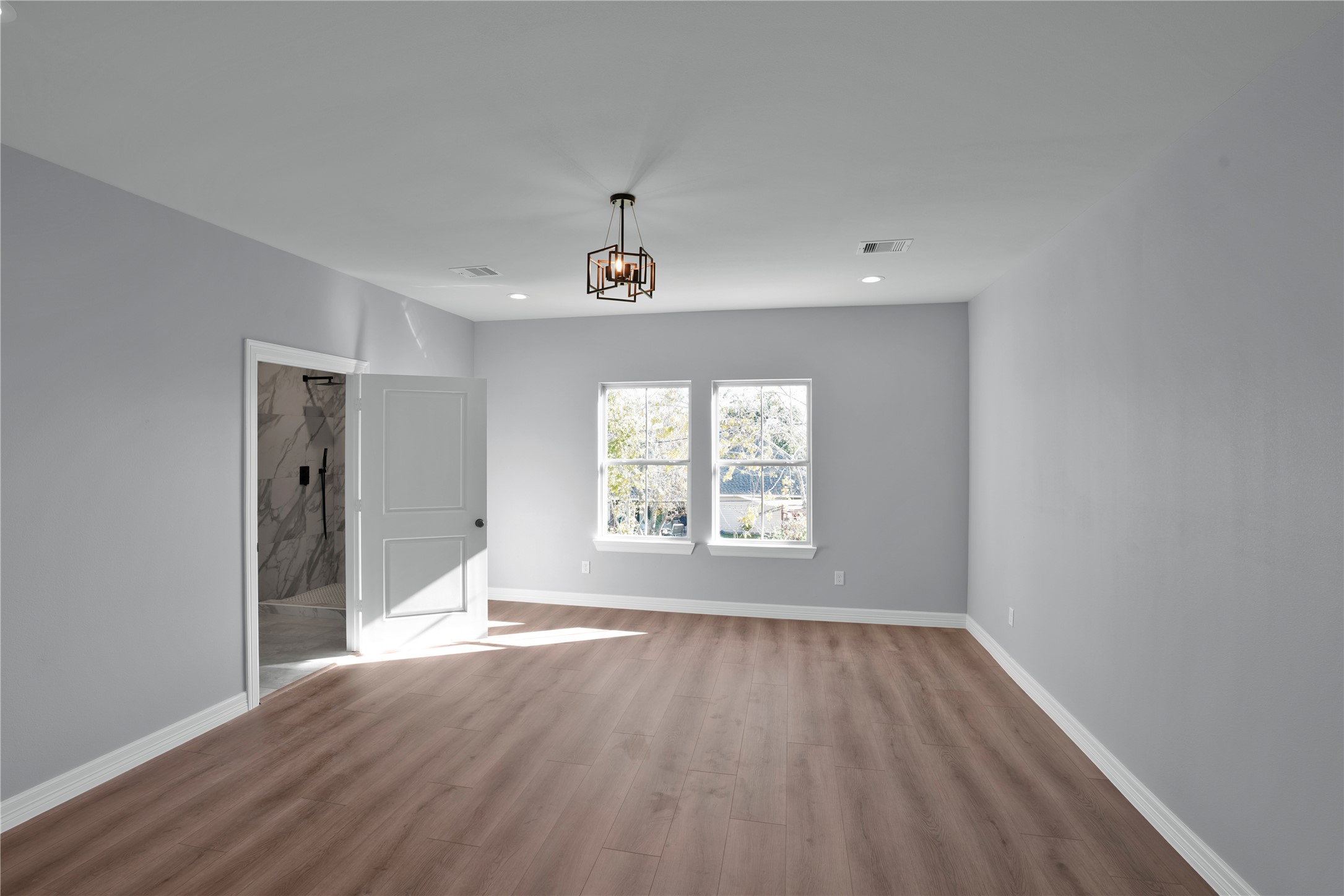 1715 Valleyview Drive La Porte, TX 77571 - Photo 13 of 15 a view of an empty room with wooden floor and a window