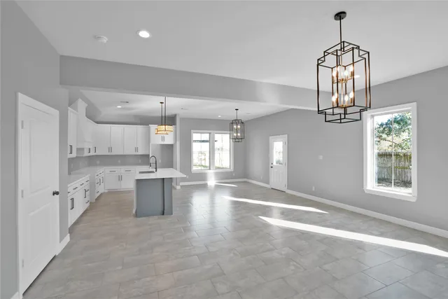 a view of a kitchen with granite countertop lots of counter top space