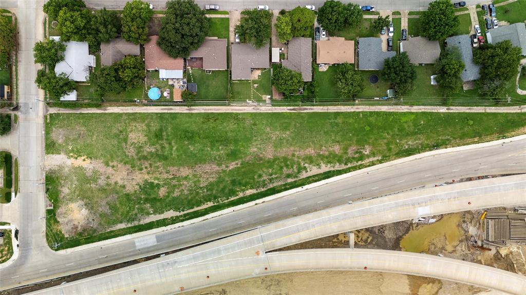 2390 Interstate 30 Mesquite, TX 75150 - Photo 4 of 19 a front view of a house with a yard and potted plants