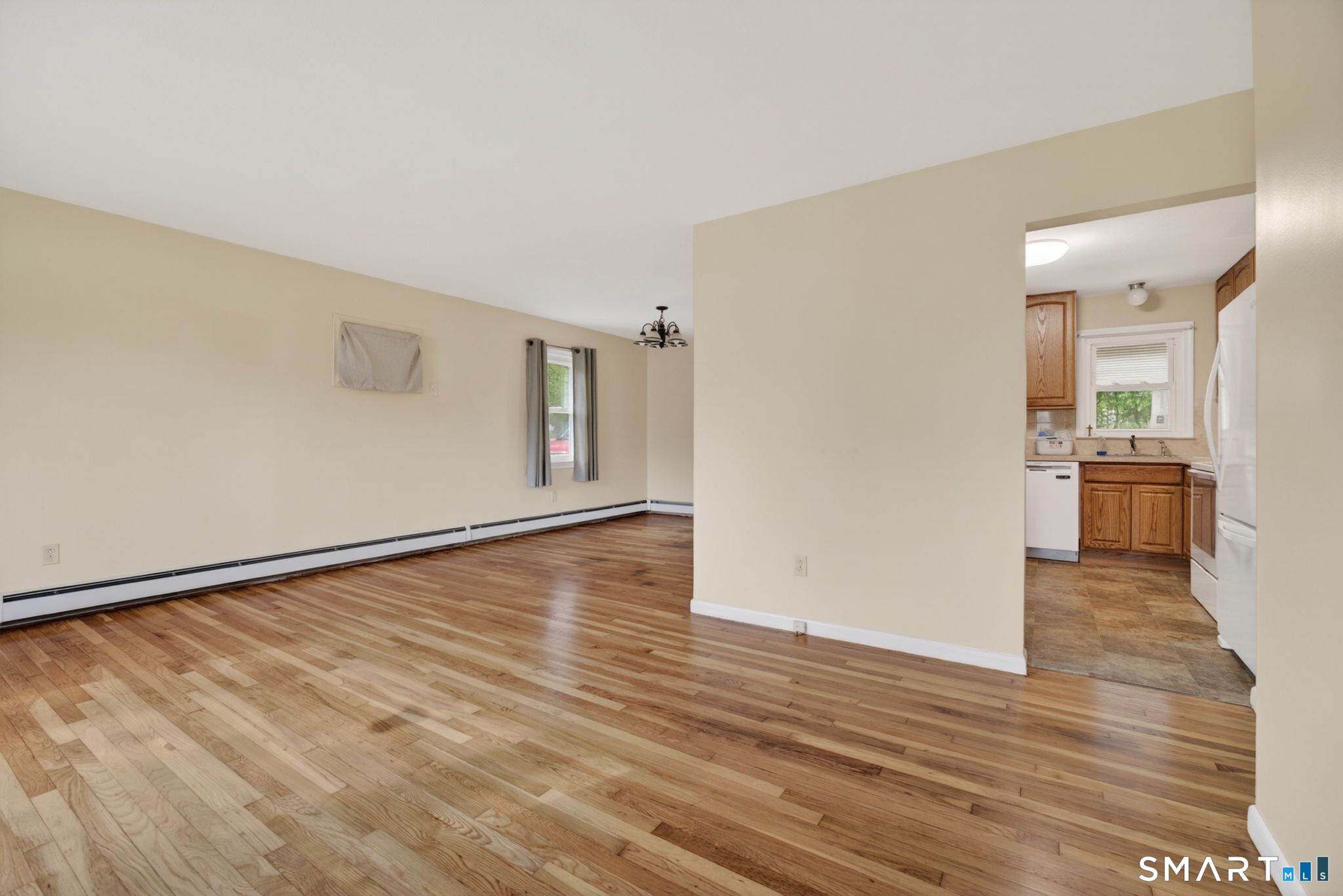 121 Cherry Hill Road Middlefield, CT 06455 - Photo 14 of 40 a view of a livingroom with wooden floor