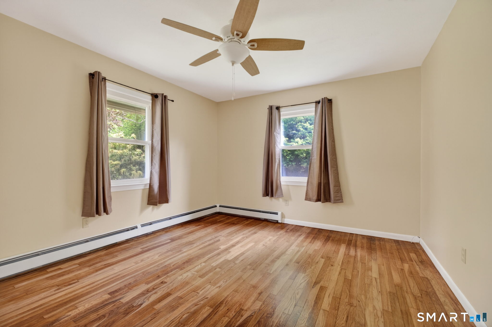 121 Cherry Hill Road Middlefield, CT 06455 - Photo 20 of 40 a view of an empty room with wooden floor and a window