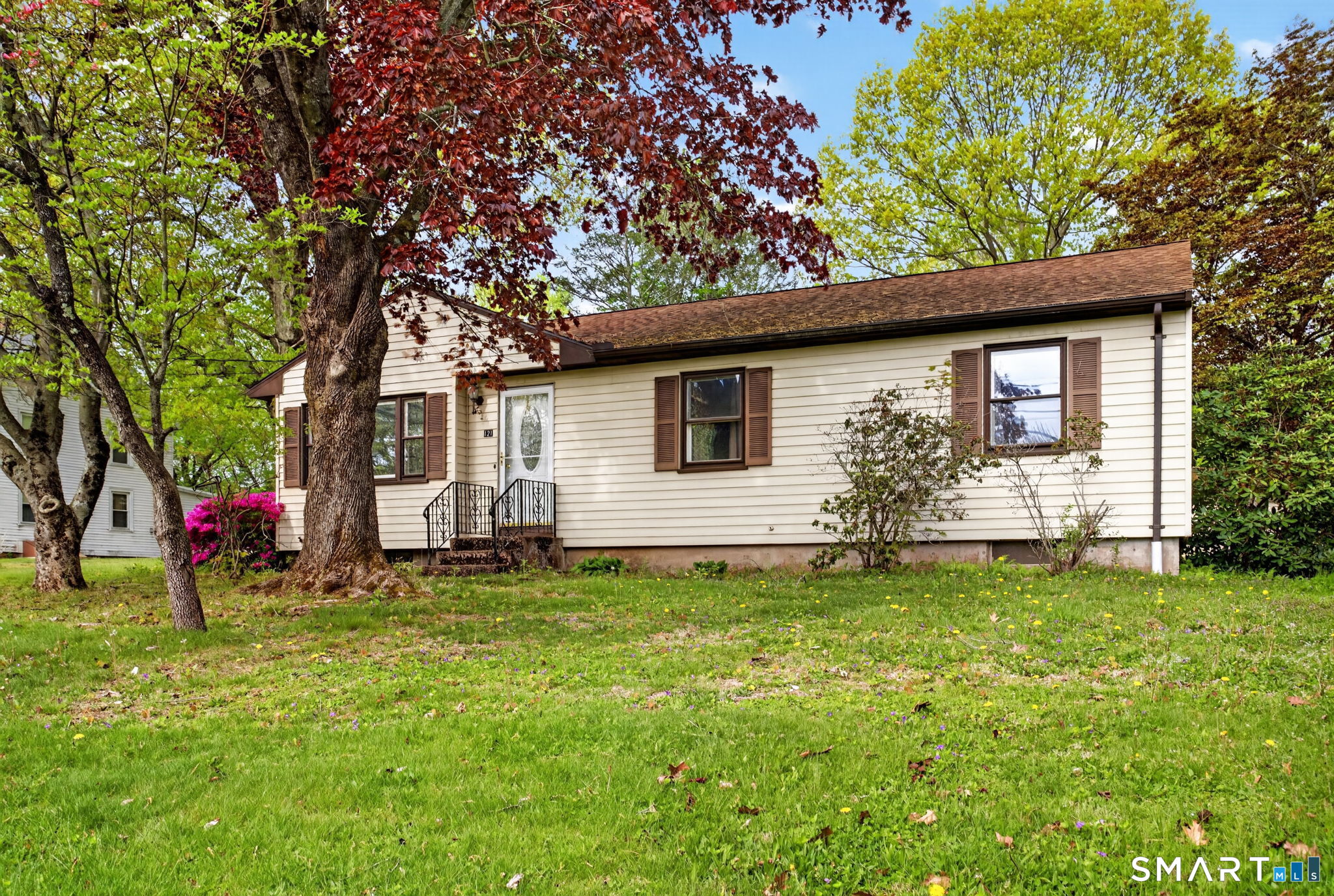 121 Cherry Hill Road Middlefield, CT 06455 - Photo 2 of 40 a backyard of a house with table and chairs