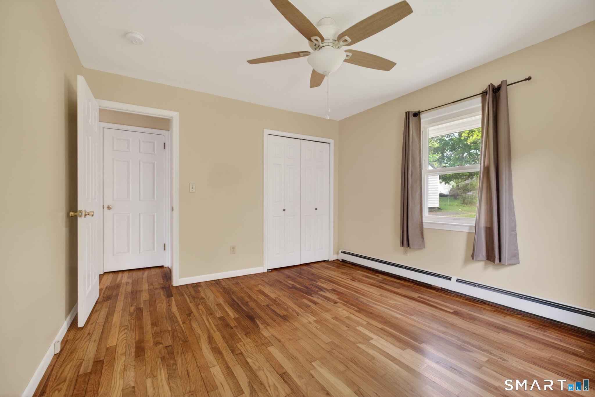 121 Cherry Hill Road Middlefield, CT 06455 - Photo 23 of 40 wooden floor in an empty room with a window