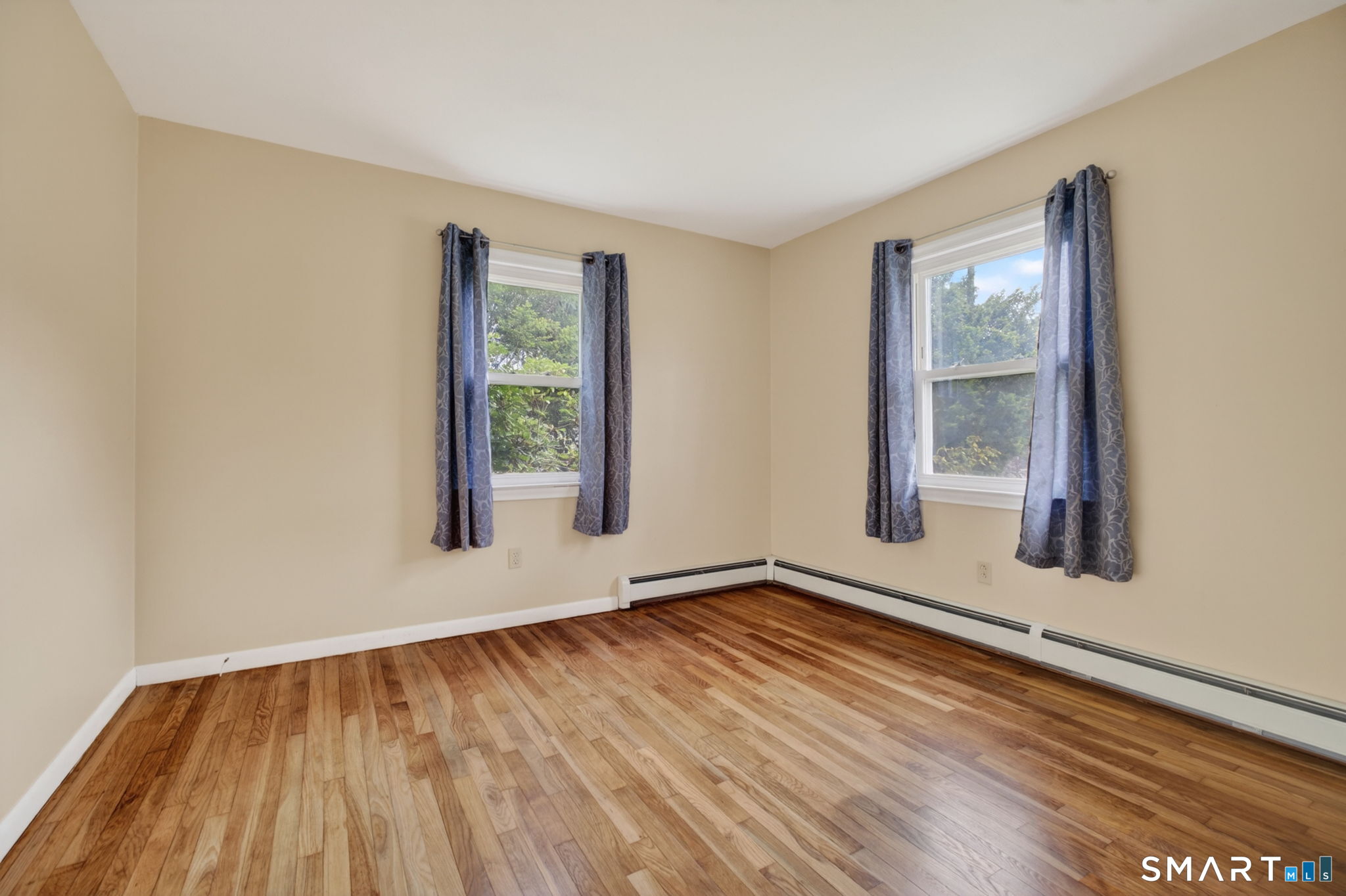 121 Cherry Hill Road Middlefield, CT 06455 - Photo 24 of 40 a view of an empty room with wooden floor and a window