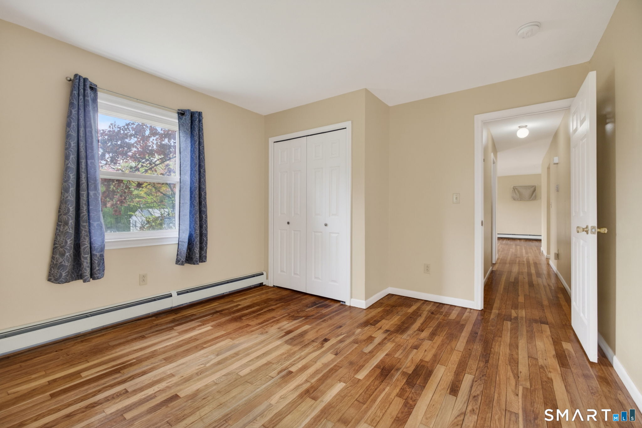 121 Cherry Hill Road Middlefield, CT 06455 - Photo 25 of 40 wooden floor in an empty room with a window