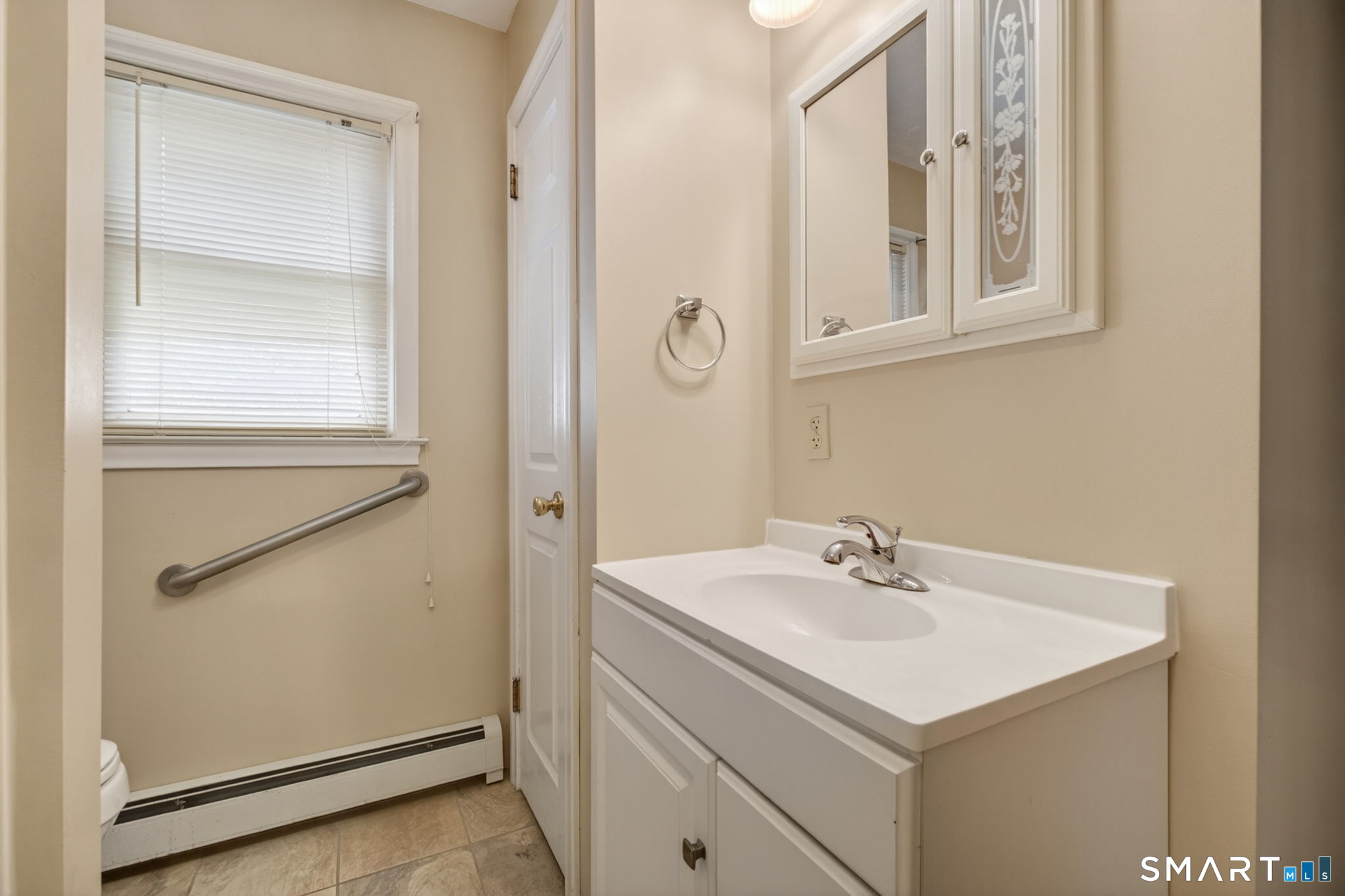121 Cherry Hill Road Middlefield, CT 06455 - Photo 27 of 40 a bathroom with a sink and mirror