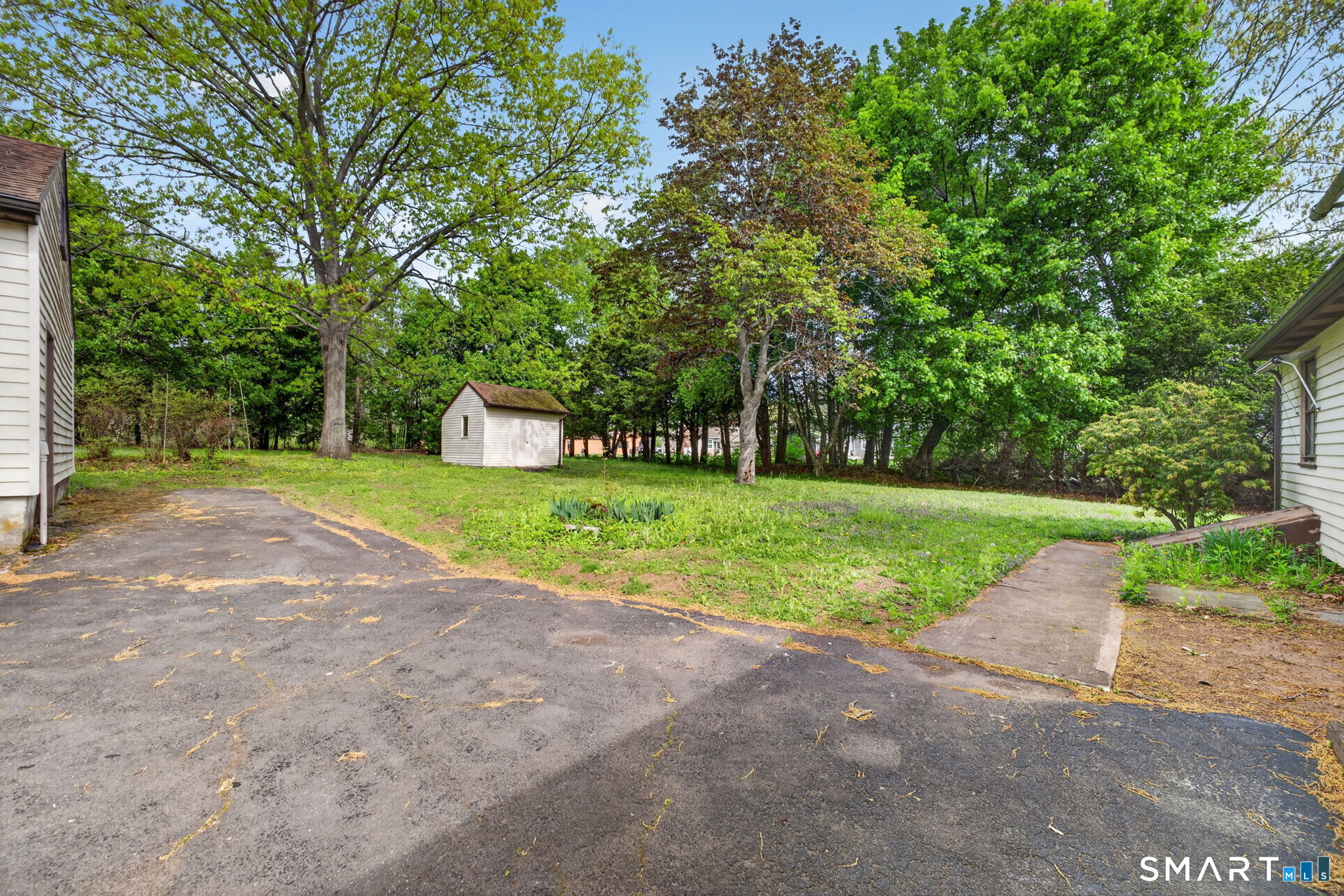 121 Cherry Hill Road Middlefield, CT 06455 - Photo 35 of 40 a view of a house with a big yard and large trees
