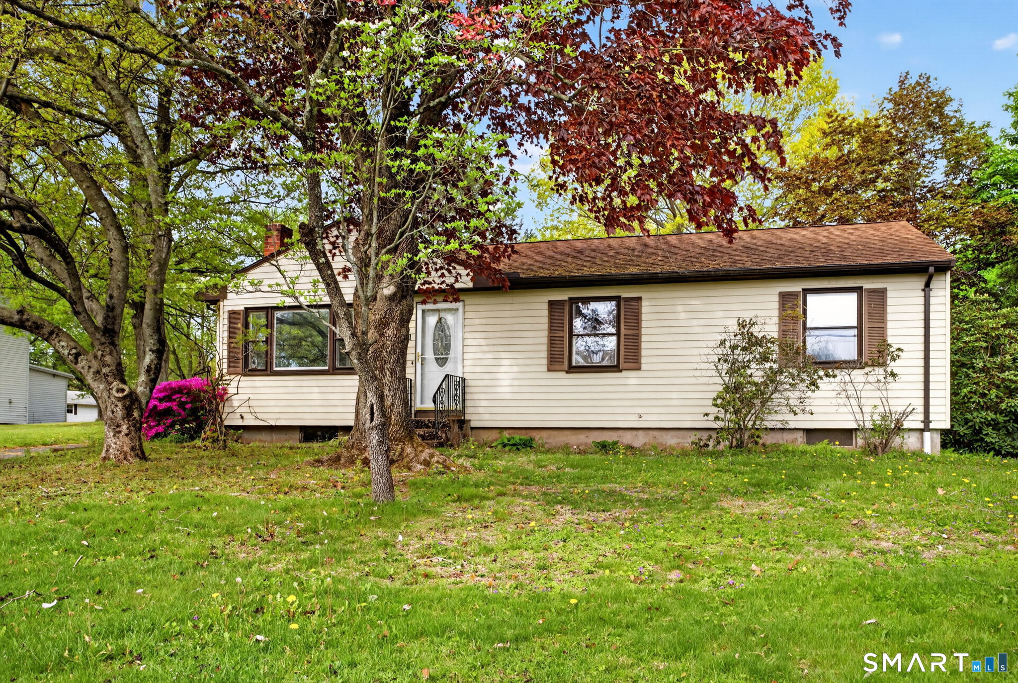 121 Cherry Hill Road Middlefield, CT 06455 - Photo 40 of 40 a front view of a house with a yard and trees