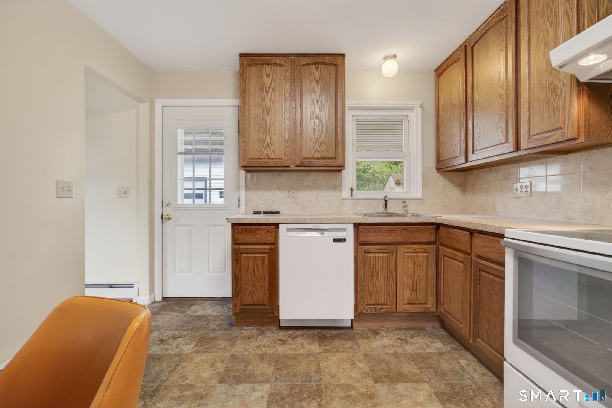 121 Cherry Hill Road Middlefield, CT 06455 - Photo 4 of 40 a kitchen with stainless steel appliances granite countertop a refrigerator sink and cabinets